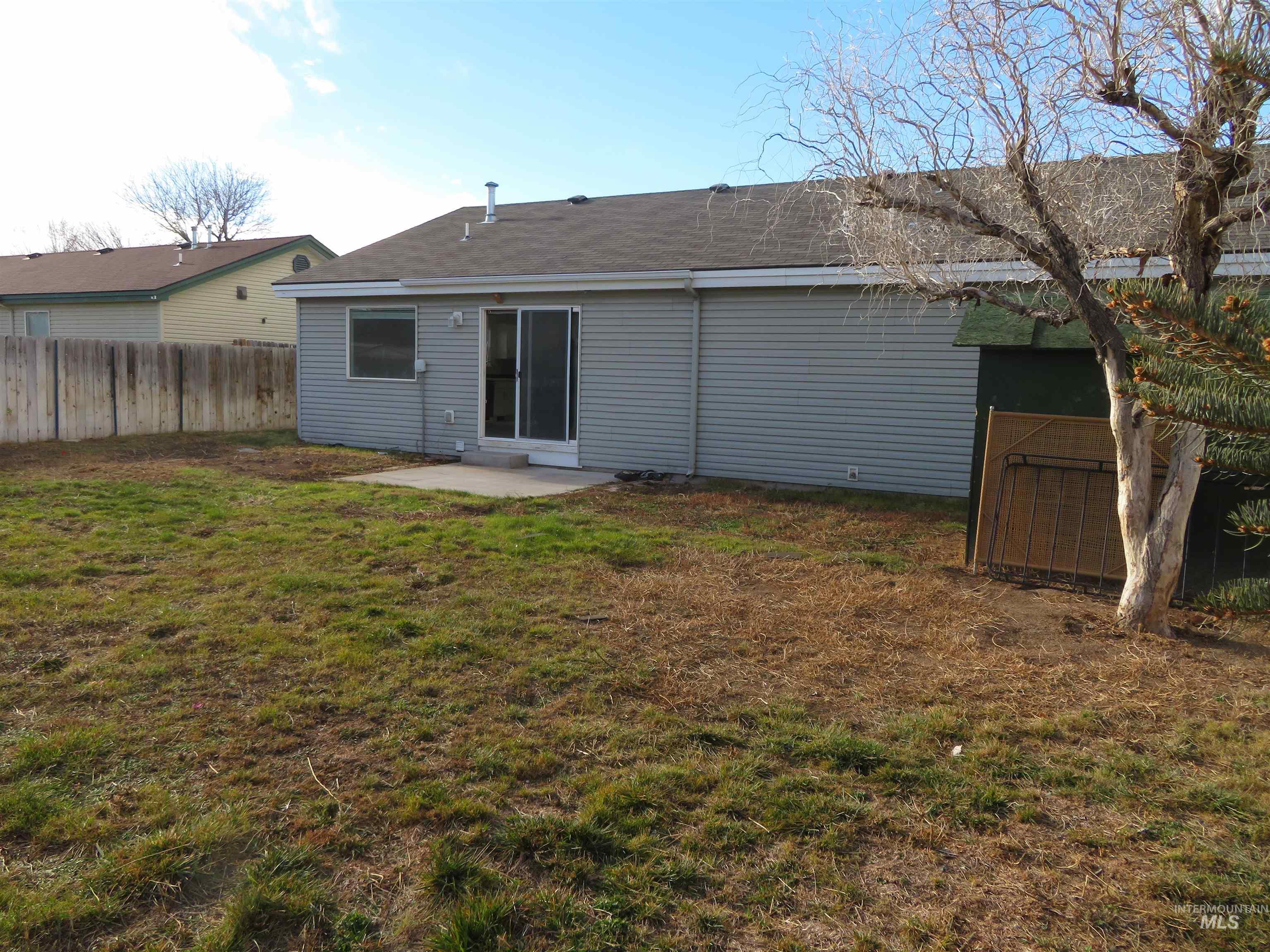 Rear view of property featuring a patio area
