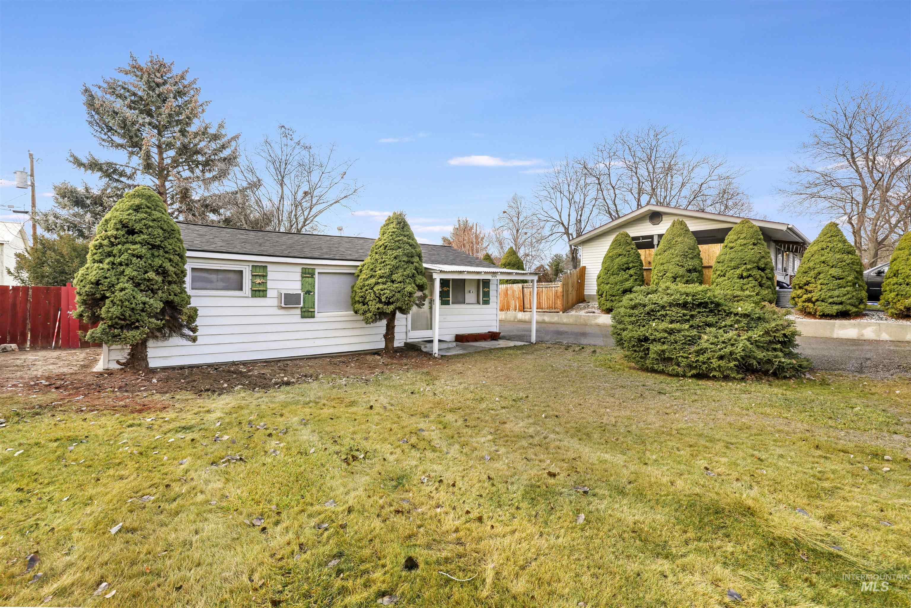 Rear view of property with a shingled roof