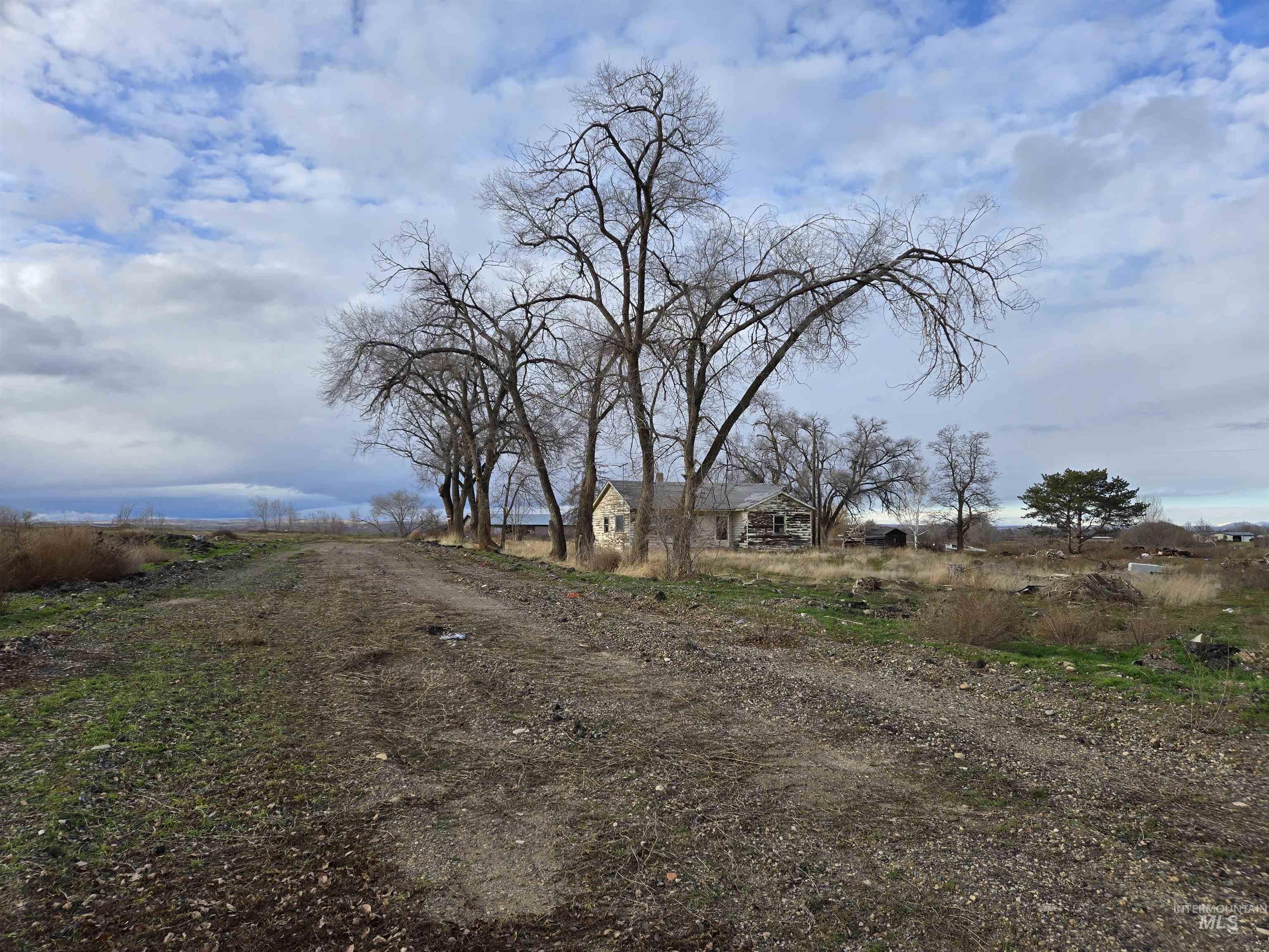 View of dirt / gravel road featuring a view of countryside