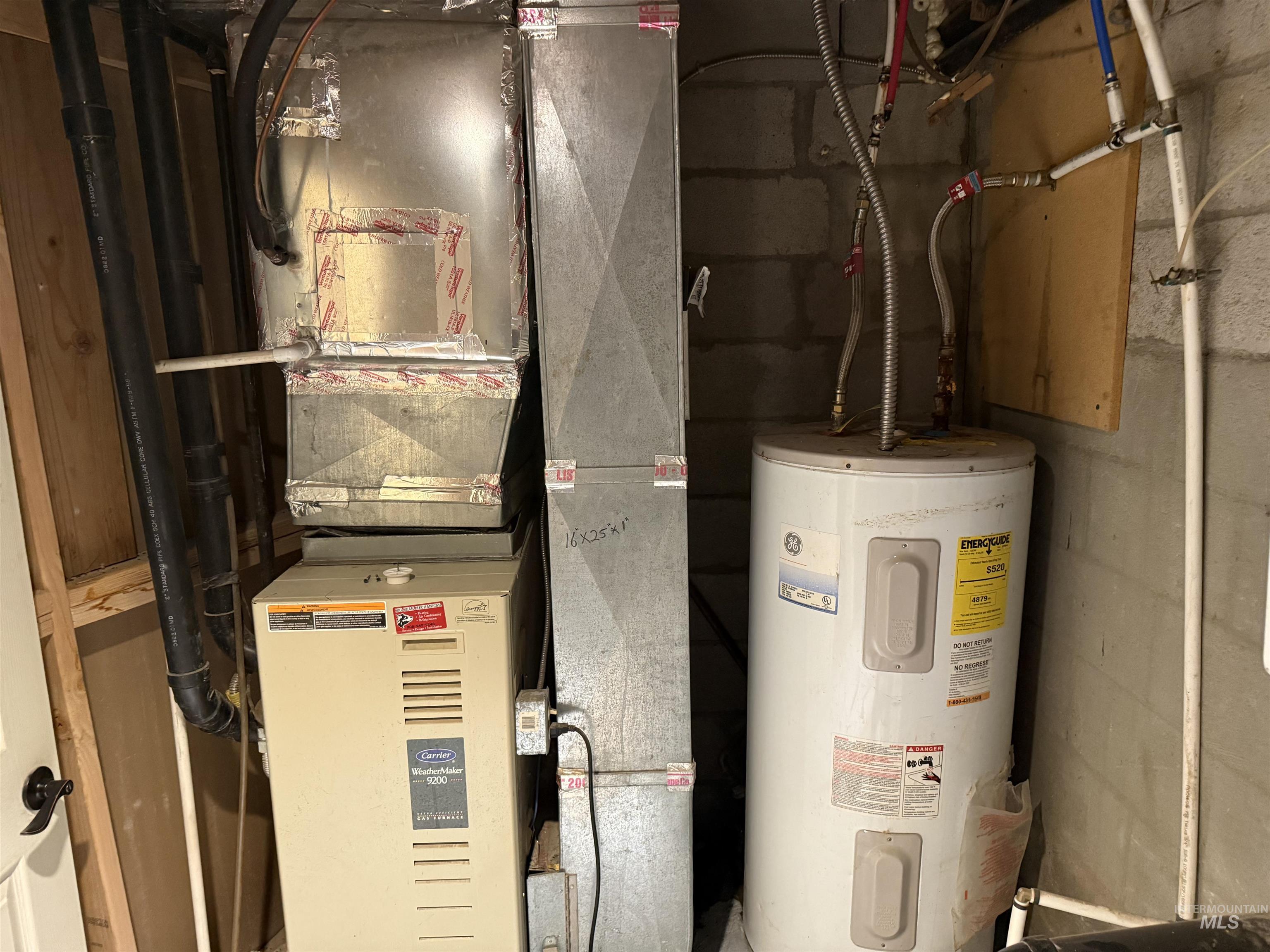 Utility room with water heater and heating unit