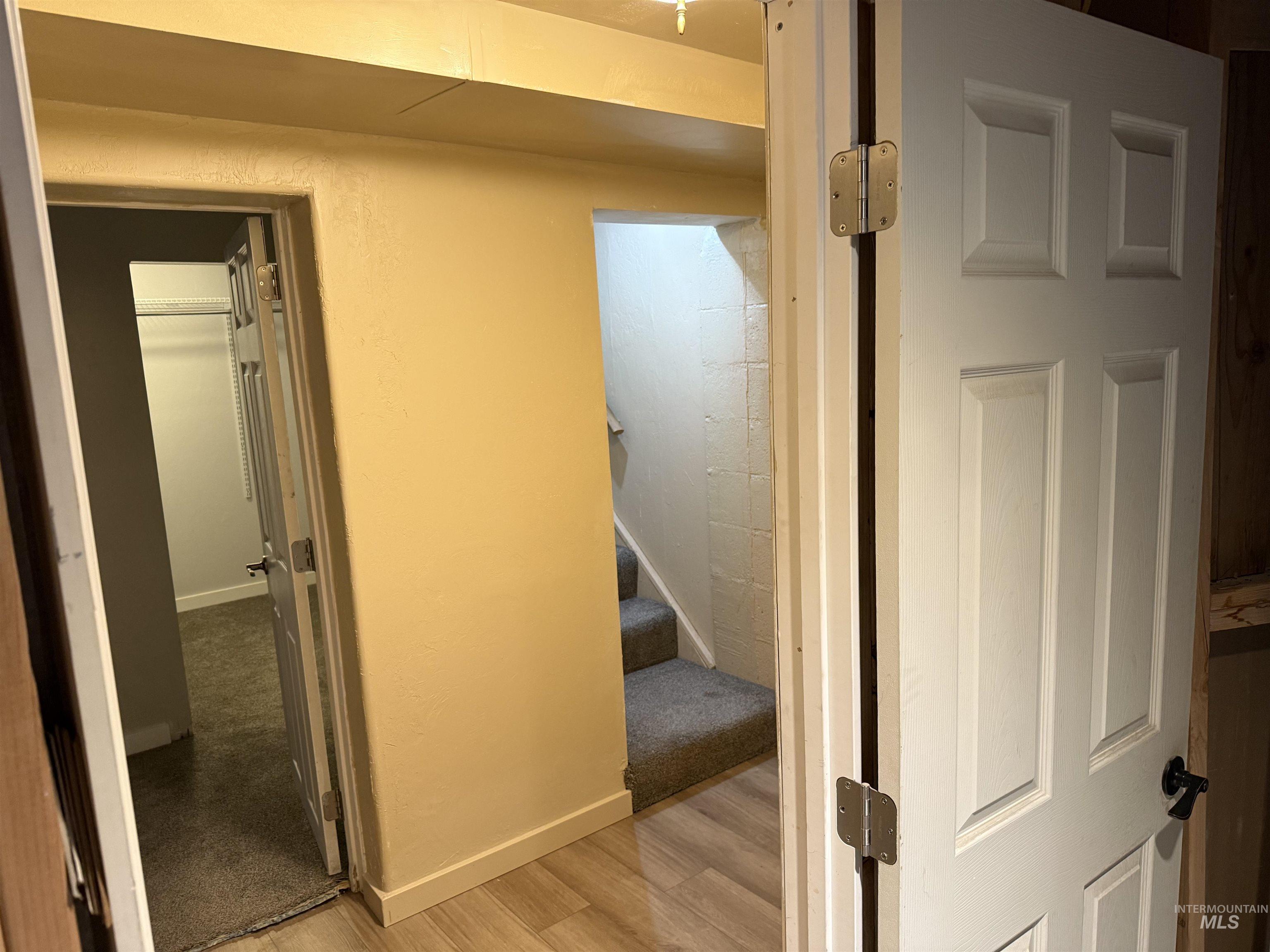 Hall with stairway and light wood-style floors
