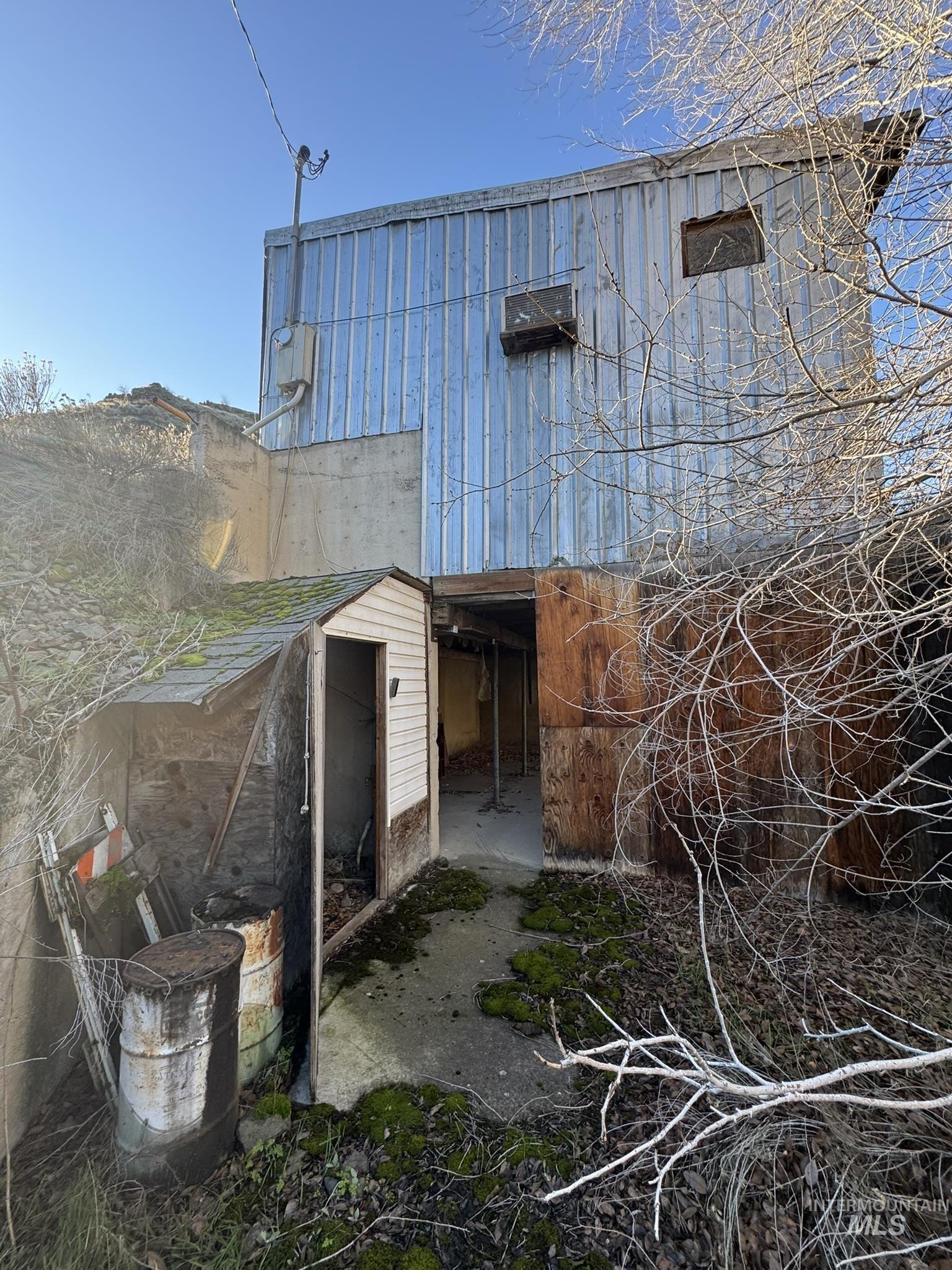 Rear view of property featuring a patio area