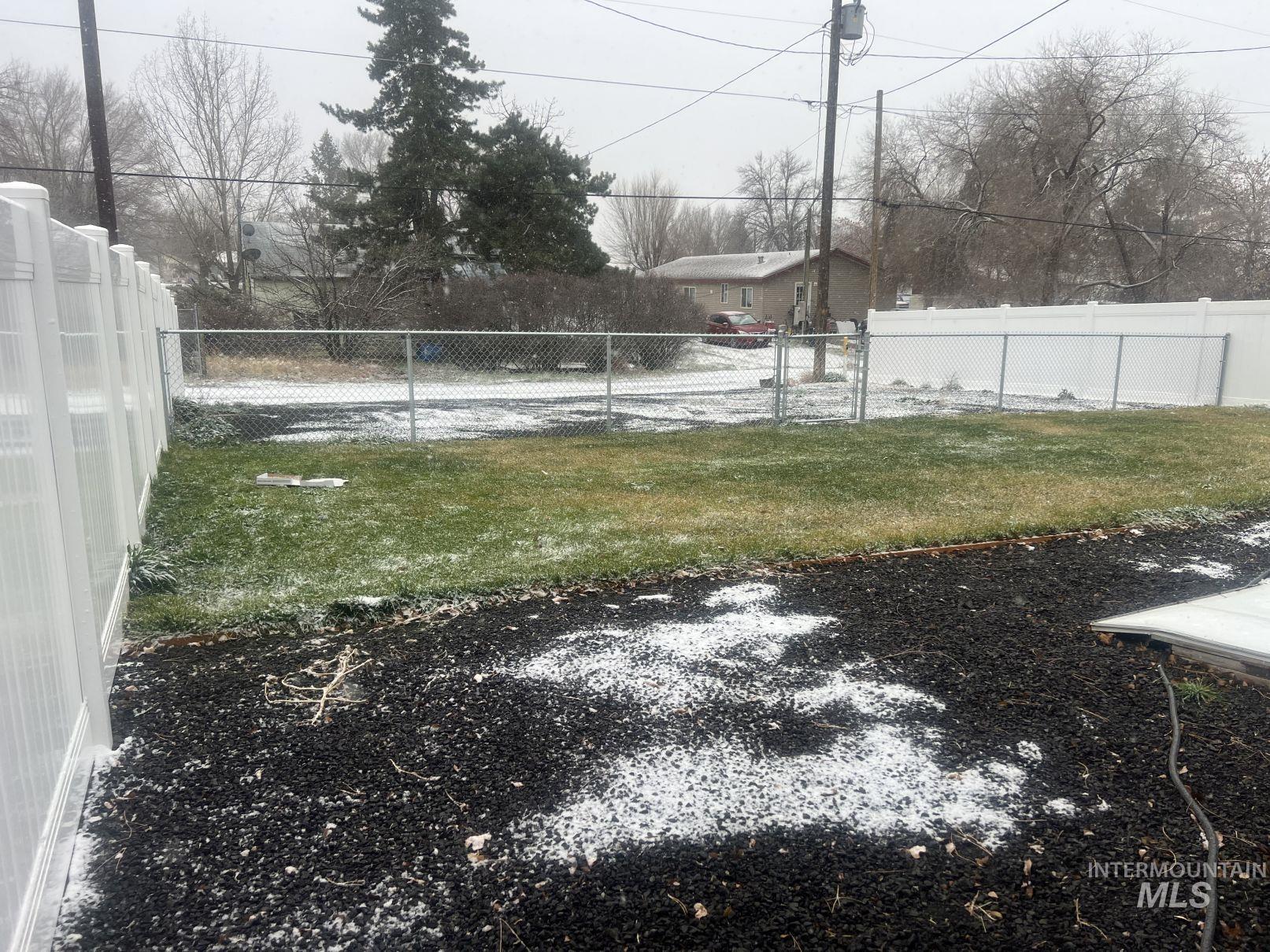View of fenced backyard