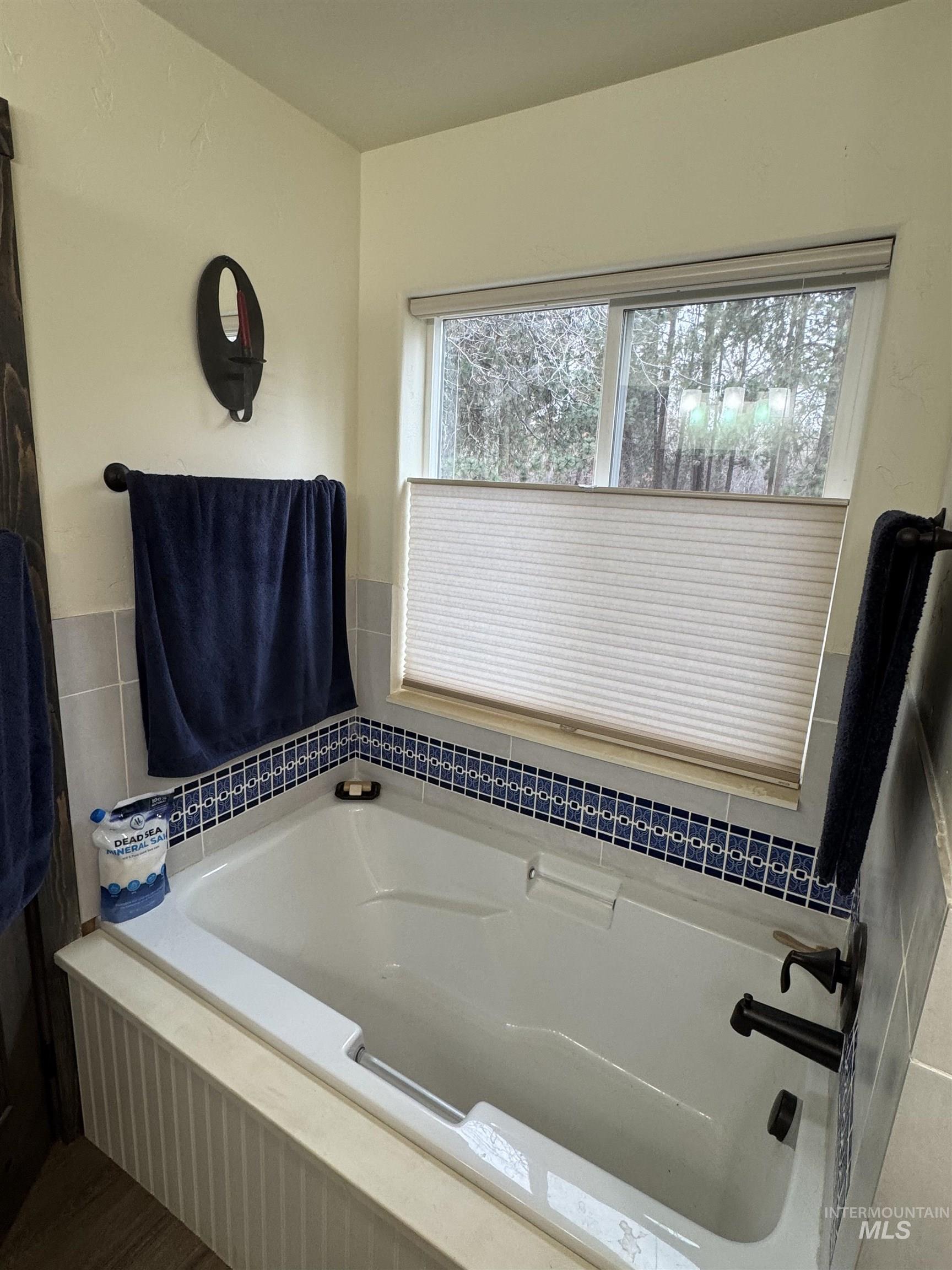 Full bathroom featuring a garden tub