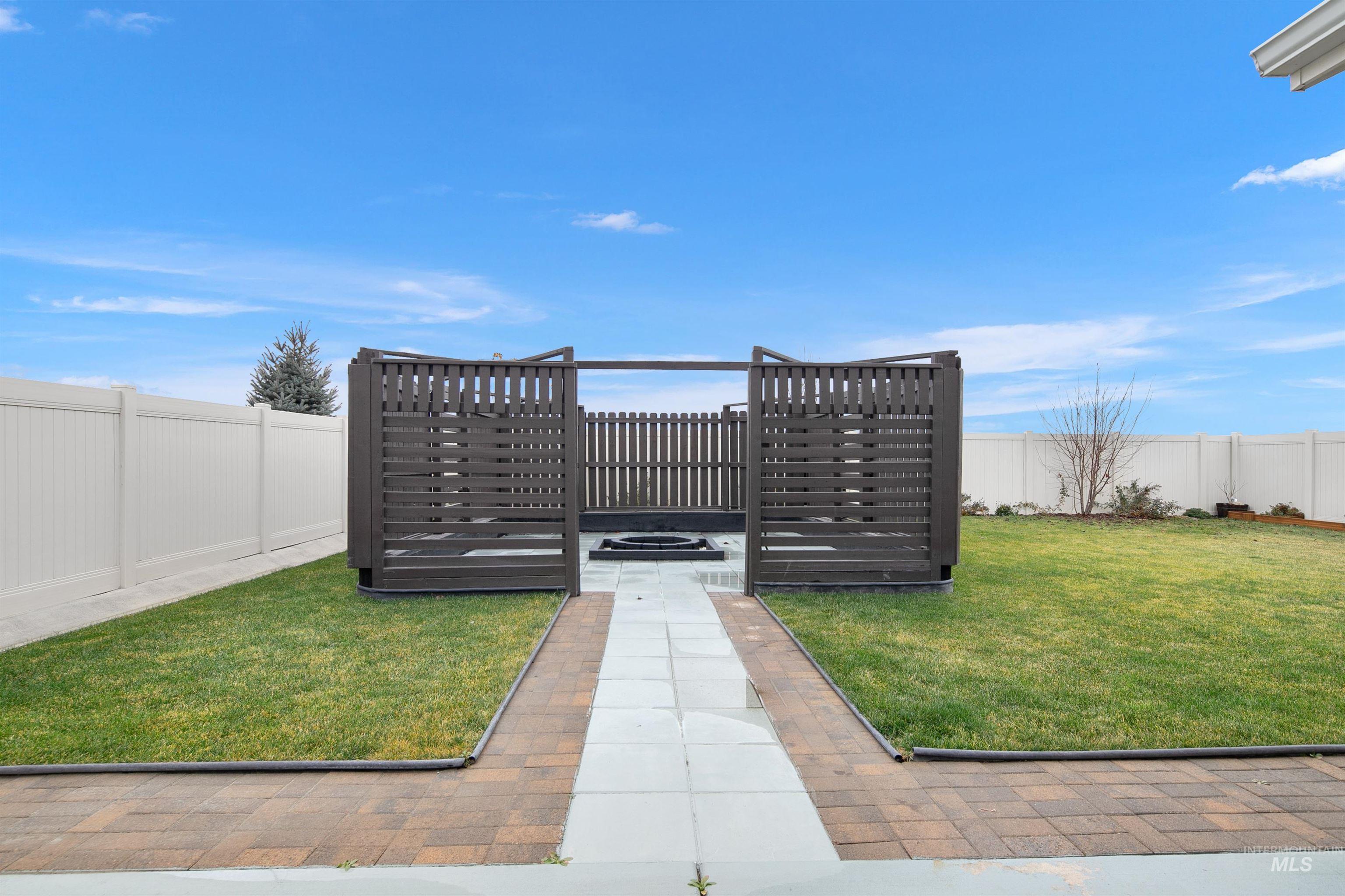 Fenced backyard featuring a patio area