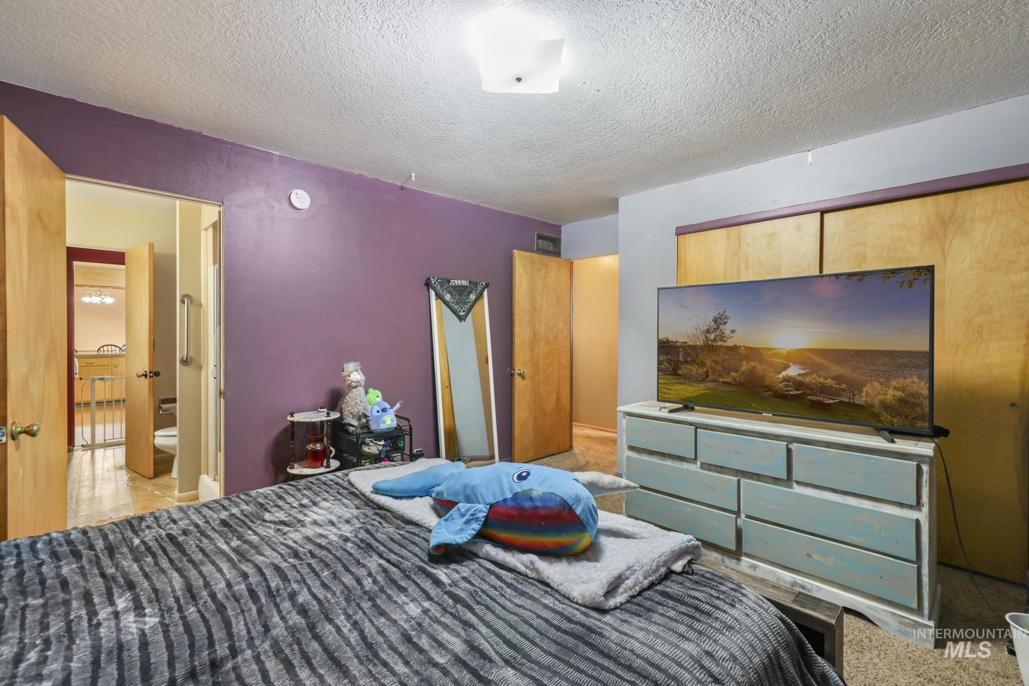 Bedroom featuring a textured ceiling