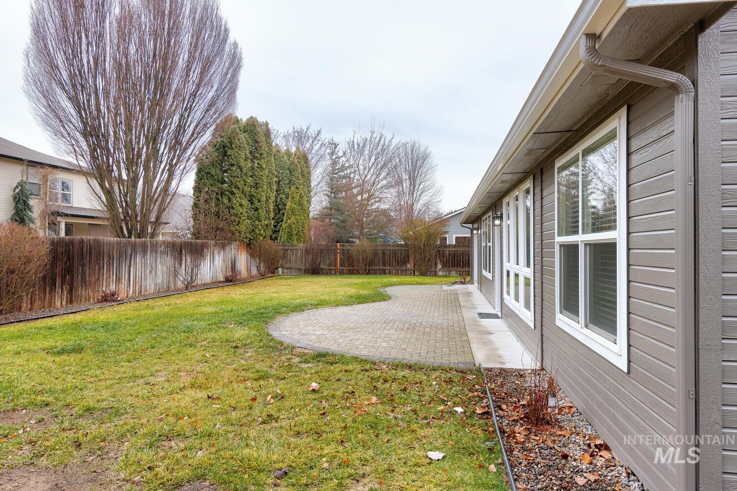 Fenced backyard featuring a patio area