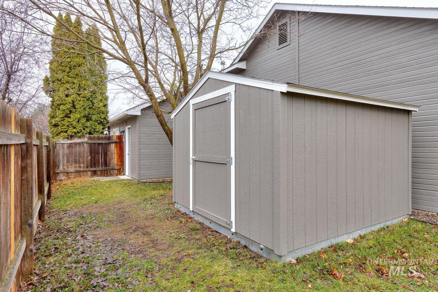 View of shed with a fenced backyard