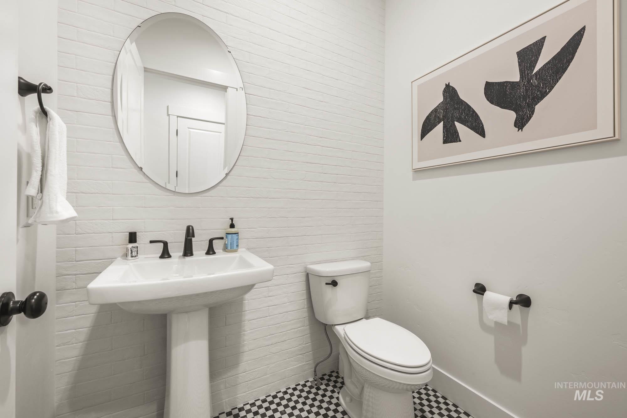 Bathroom featuring toilet and baseboards