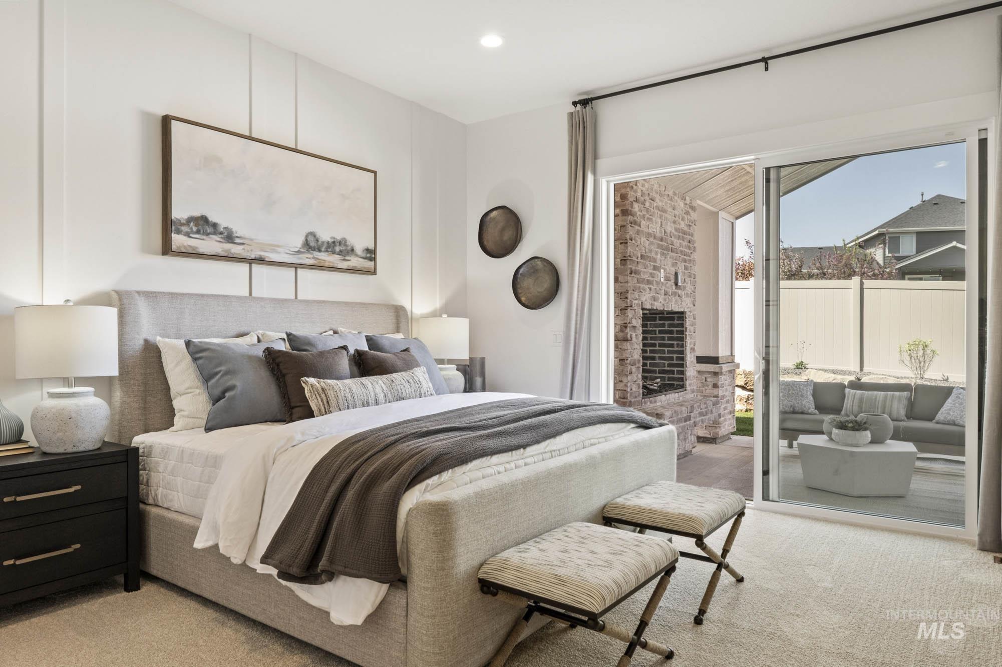 Bedroom featuring light carpet, access to exterior, and recessed lighting