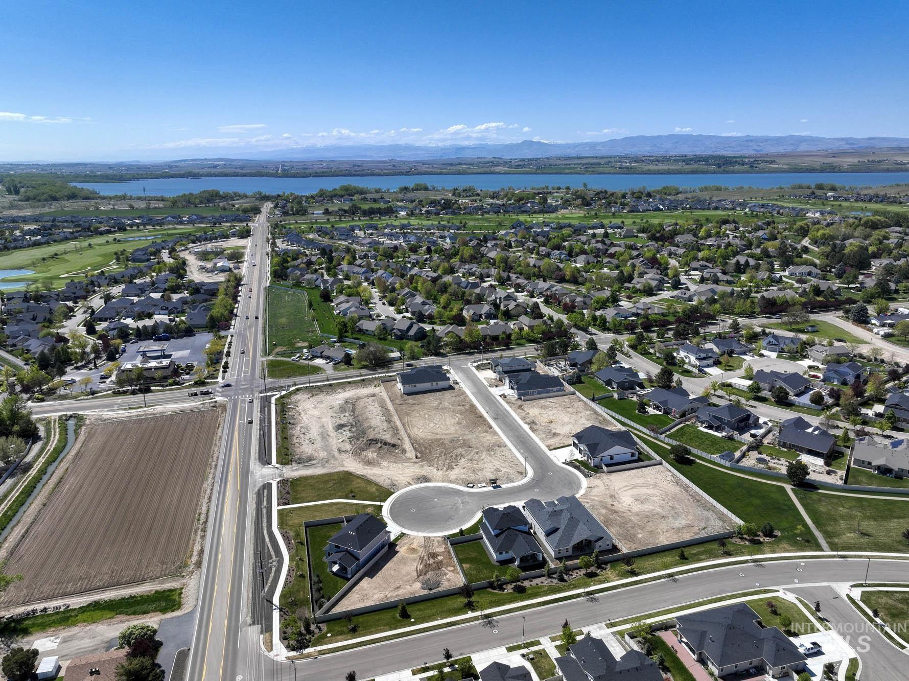 View of property location featuring nearby suburban area and a large body of water