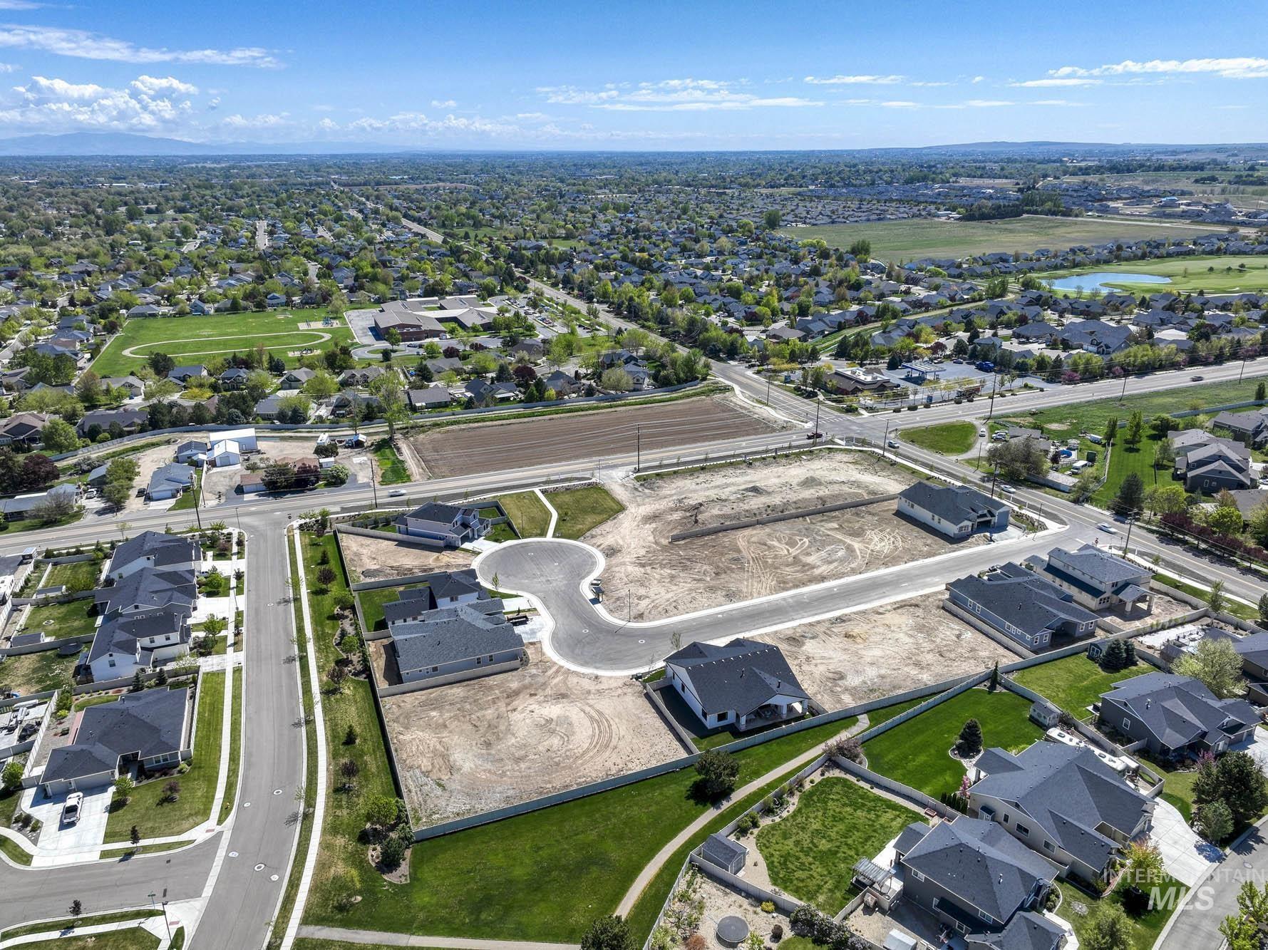 View of property location with nearby suburban area