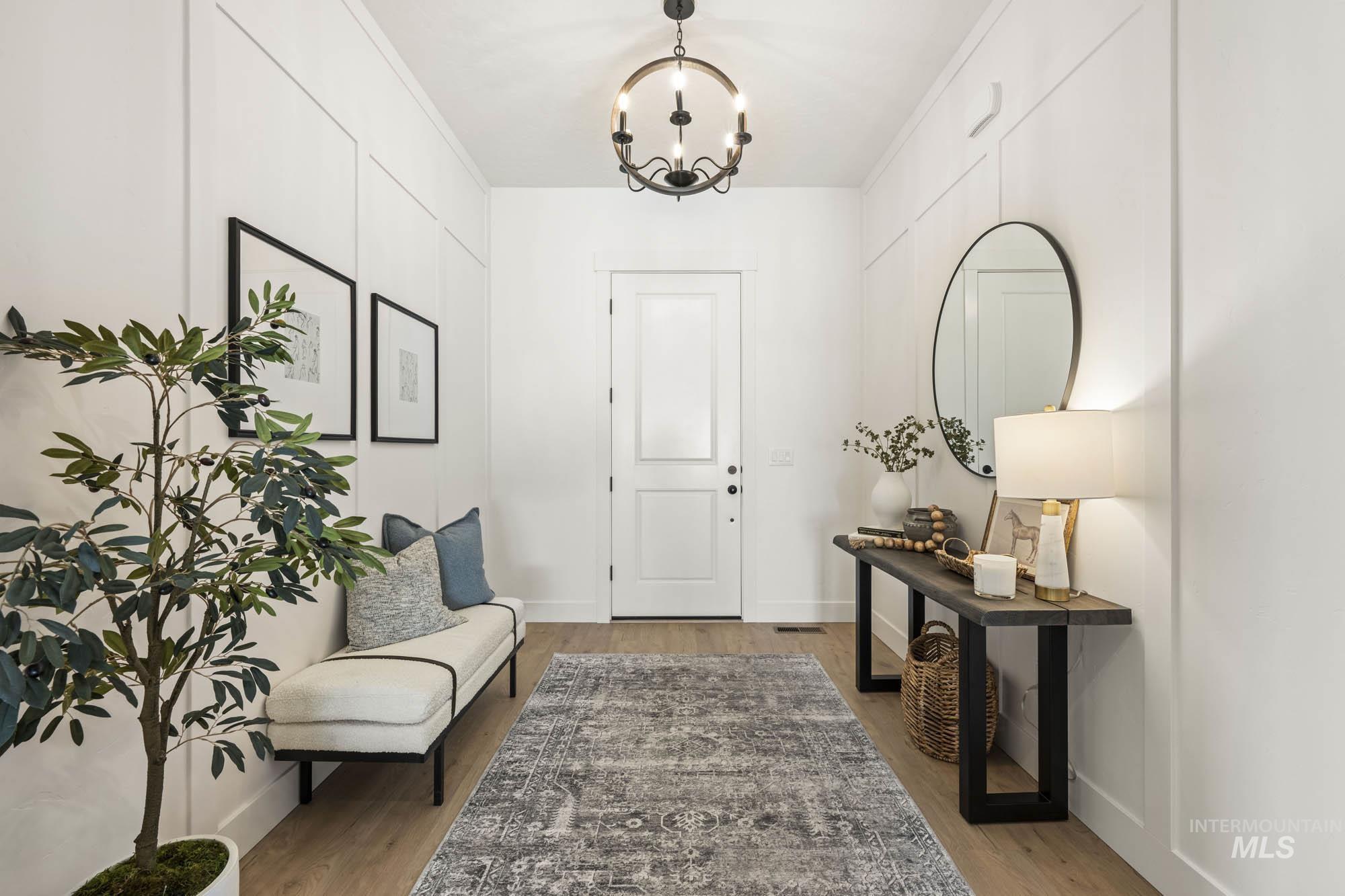 Entryway featuring a chandelier and light wood finished floors