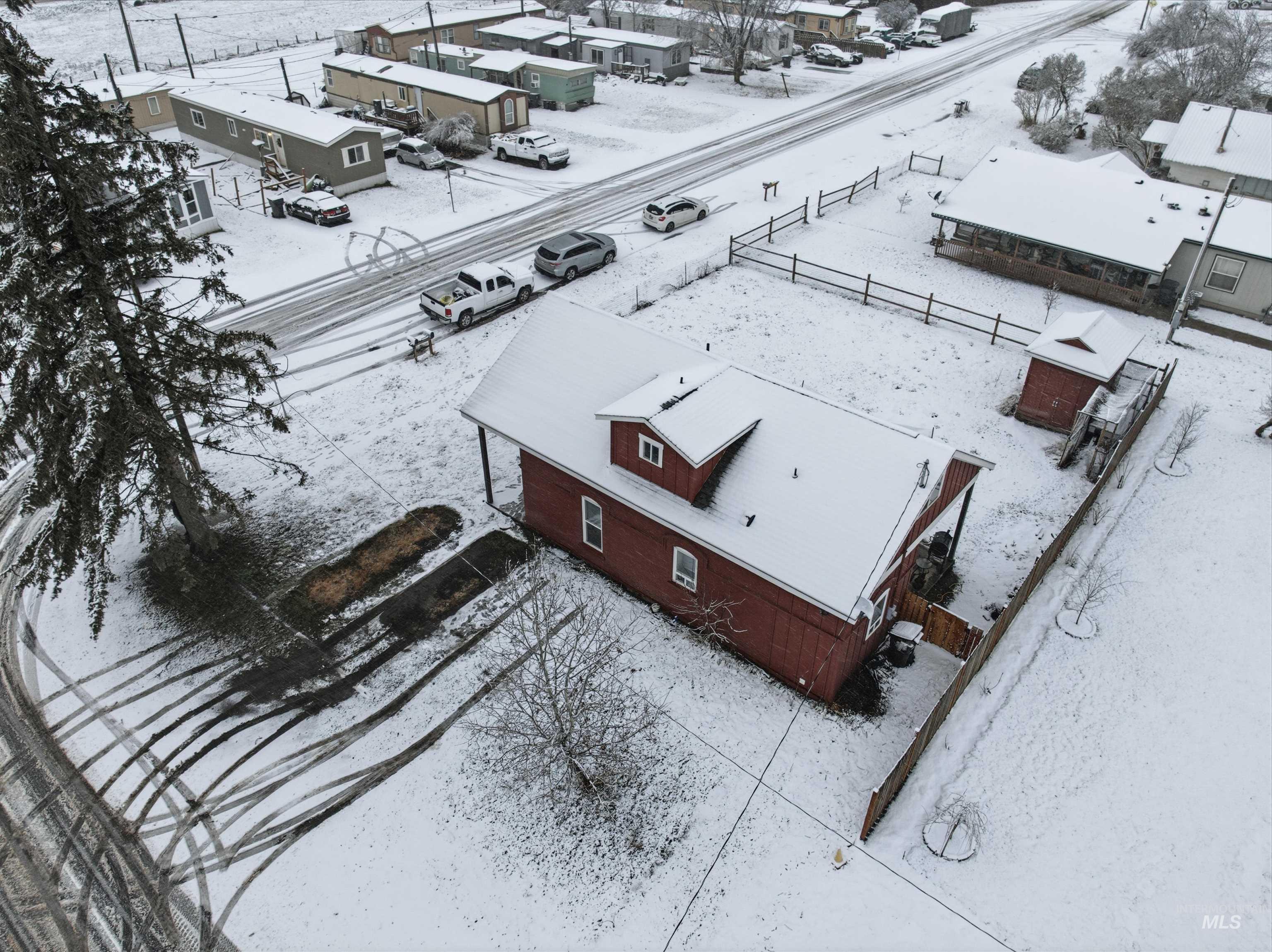 Snowy aerial view featuring a residential view