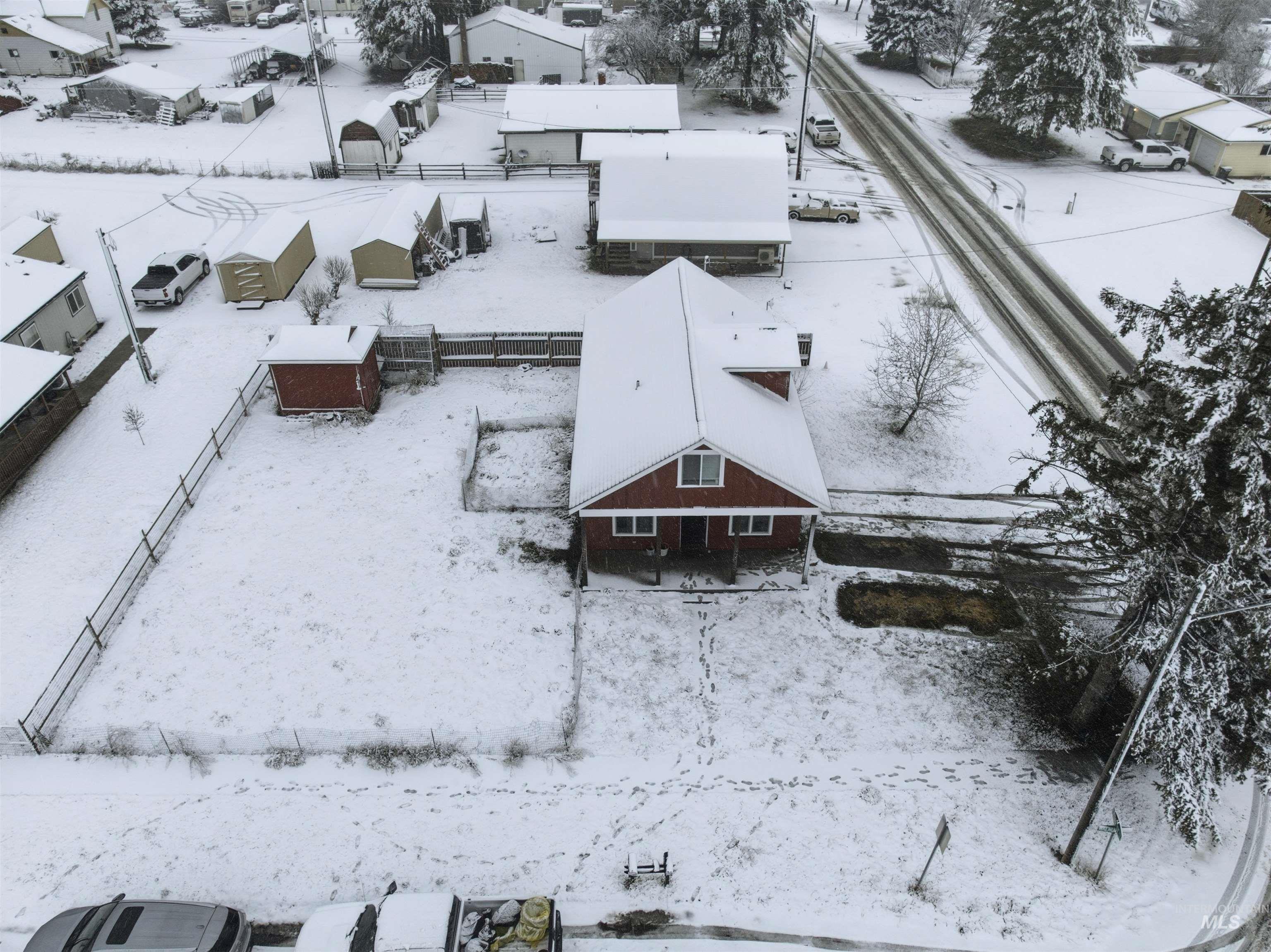 Snowy aerial view with a residential view
