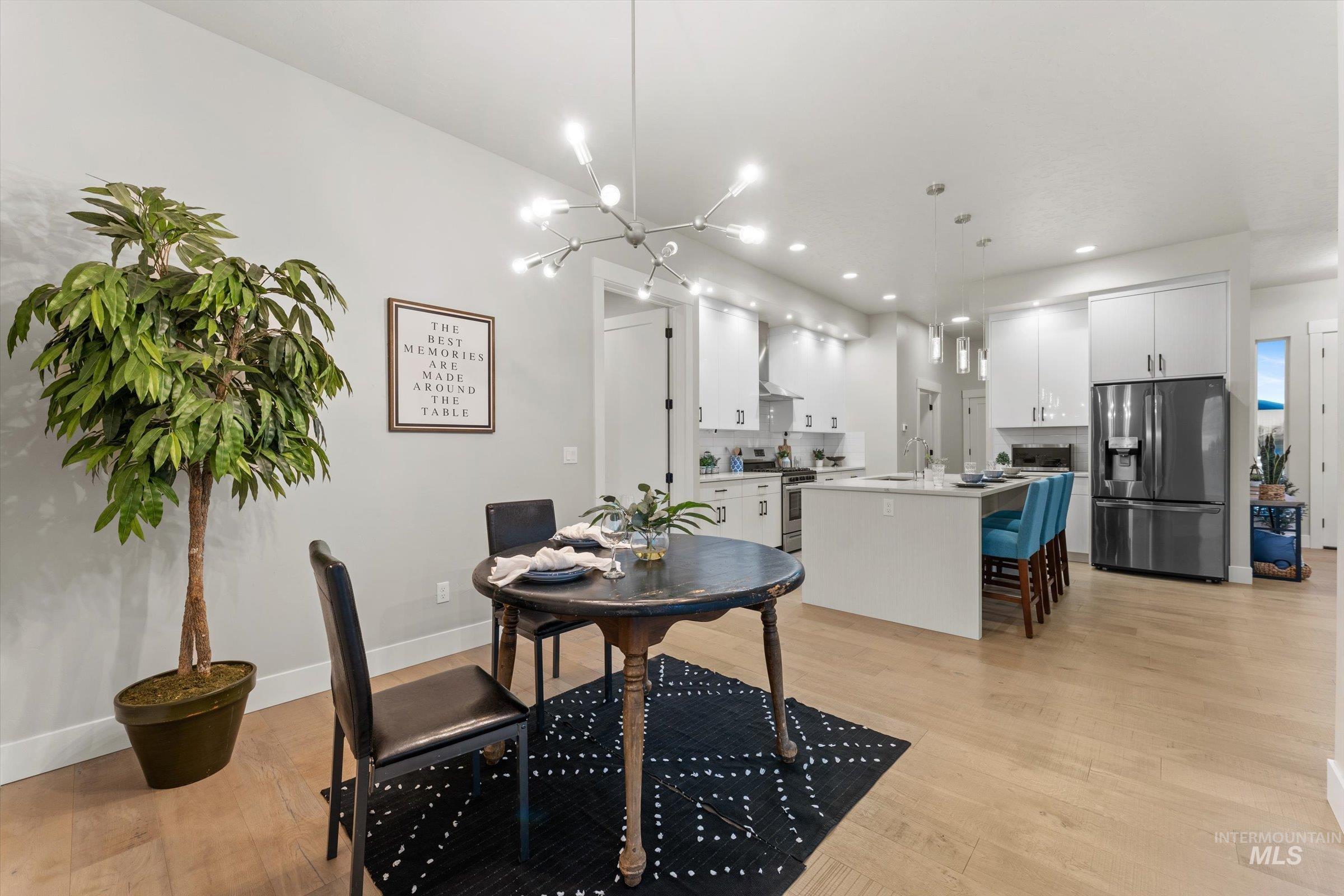 Dining room featuring a chandelier, light wood-style flooring