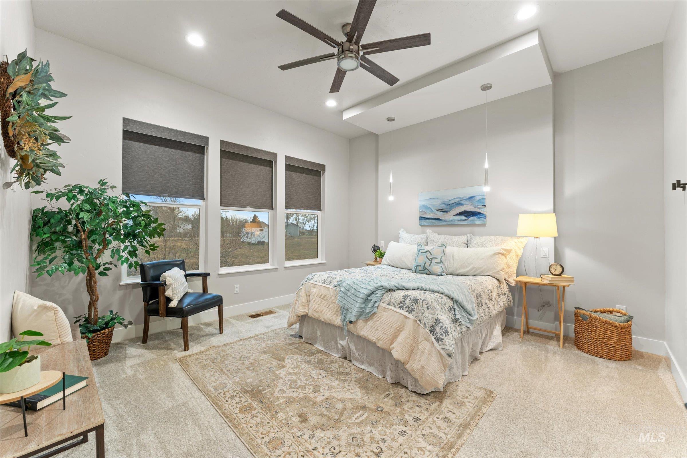 Bedroom featuring ceiling fan, light colored carpet, and recessed lighting