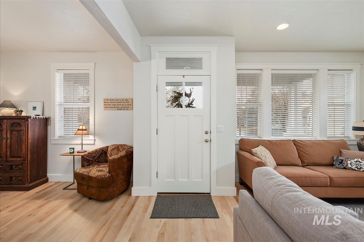 Foyer entrance featuring plenty of natural light, light wood-style flooring, and recessed lighting