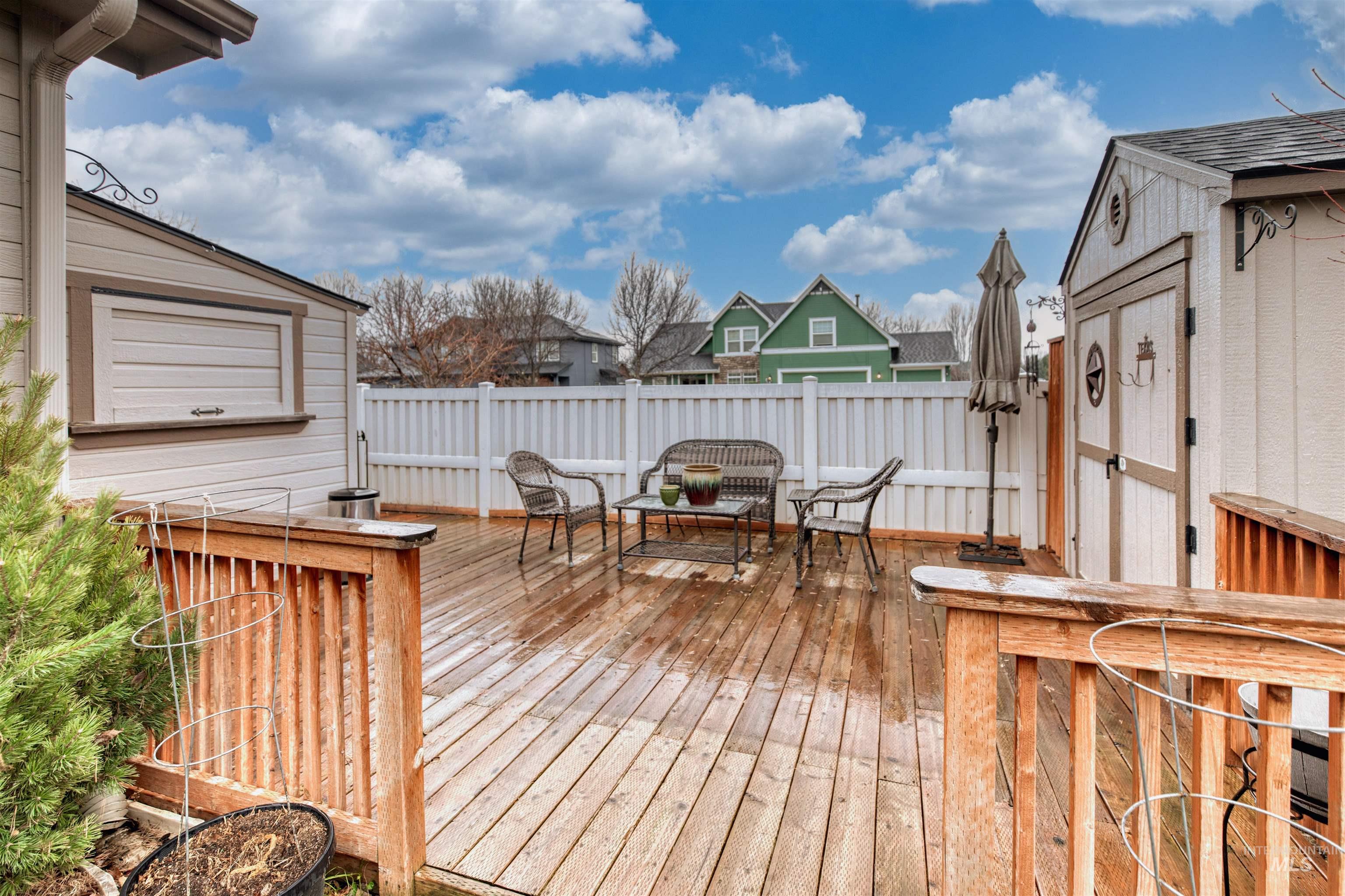 Wooden deck featuring an outdoor structure