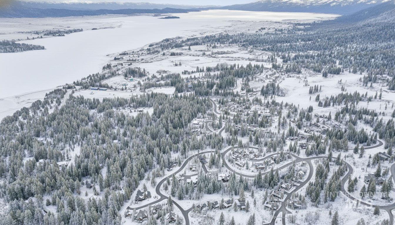 Snowy aerial view featuring a mountain view