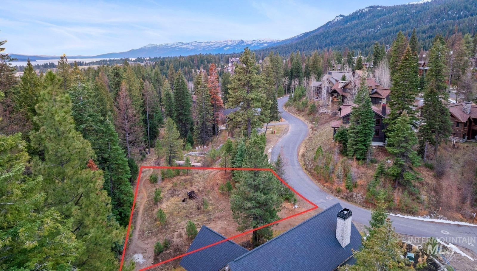 Aerial overview of property's location featuring mountains and property parcel outlined