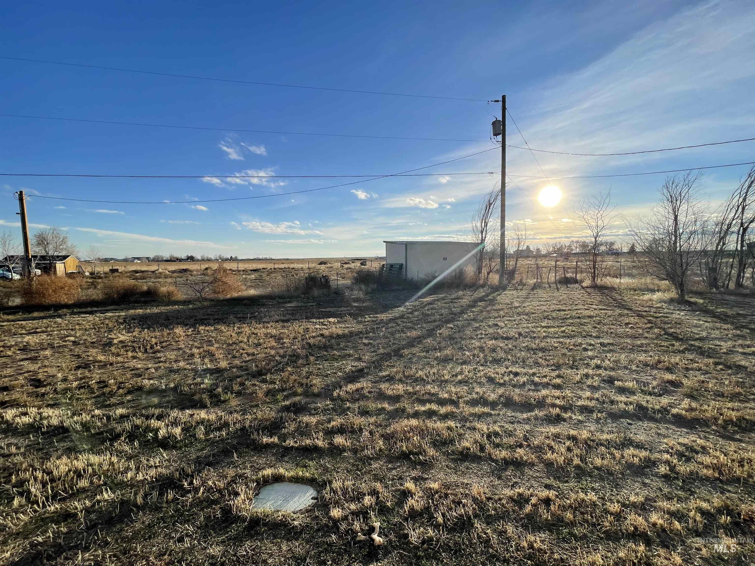 View of yard featuring an outbuilding and a view of countryside