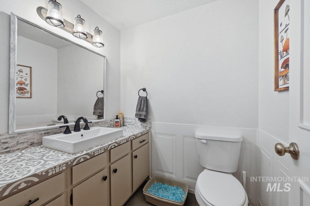 Bathroom featuring wainscoting and vanity