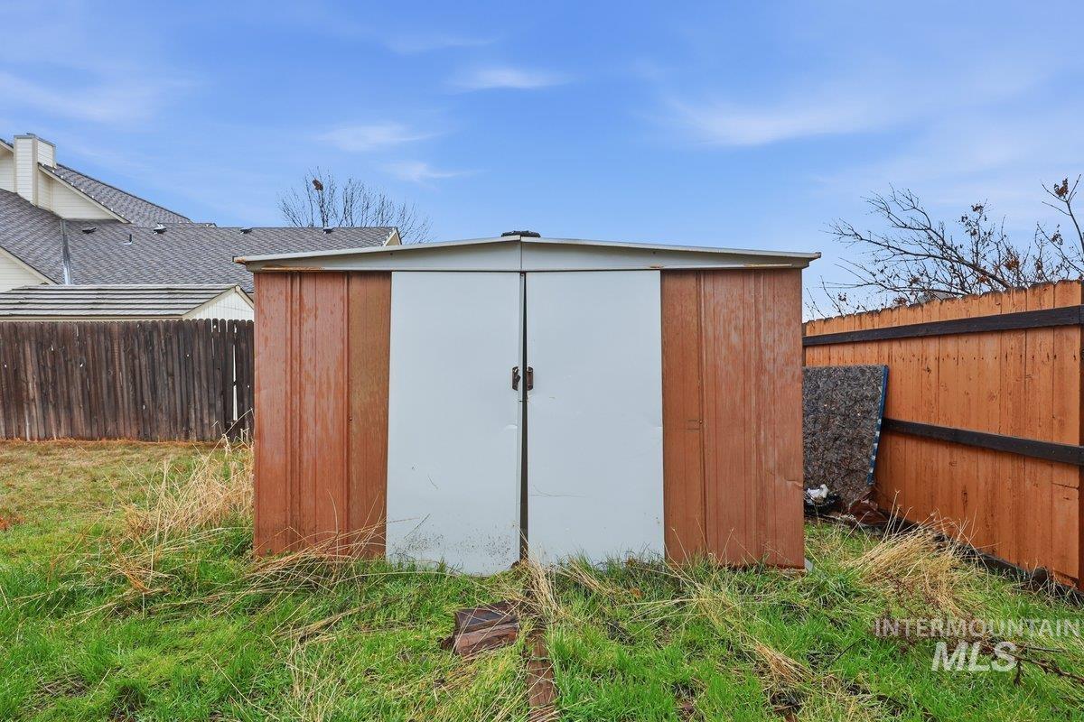 View of shed featuring a fenced backyard