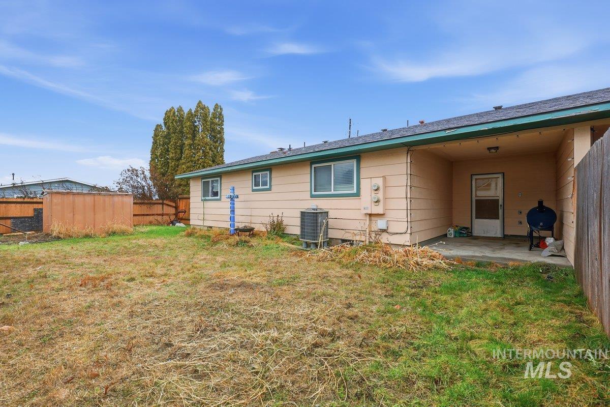 Back of house with a patio
