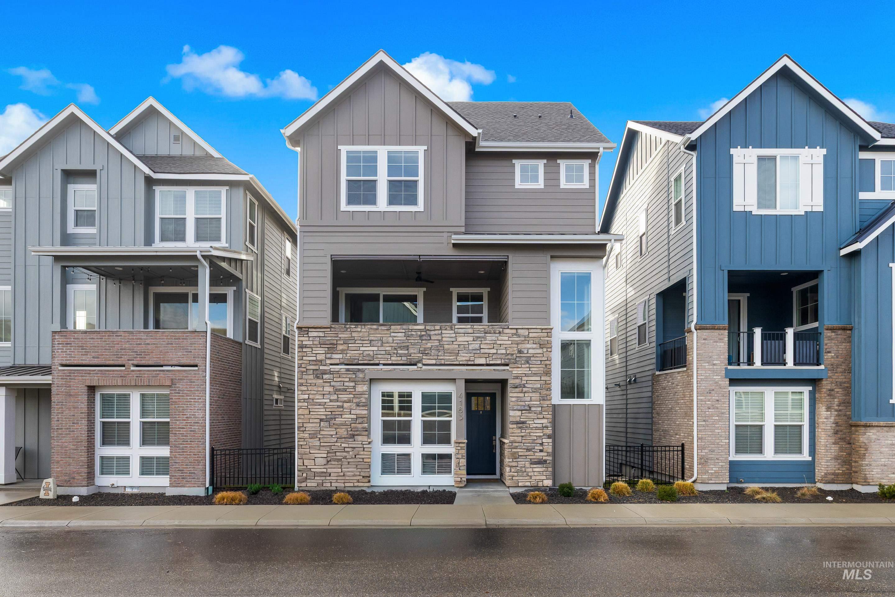 View of front facade with board and batten siding and a residential view
