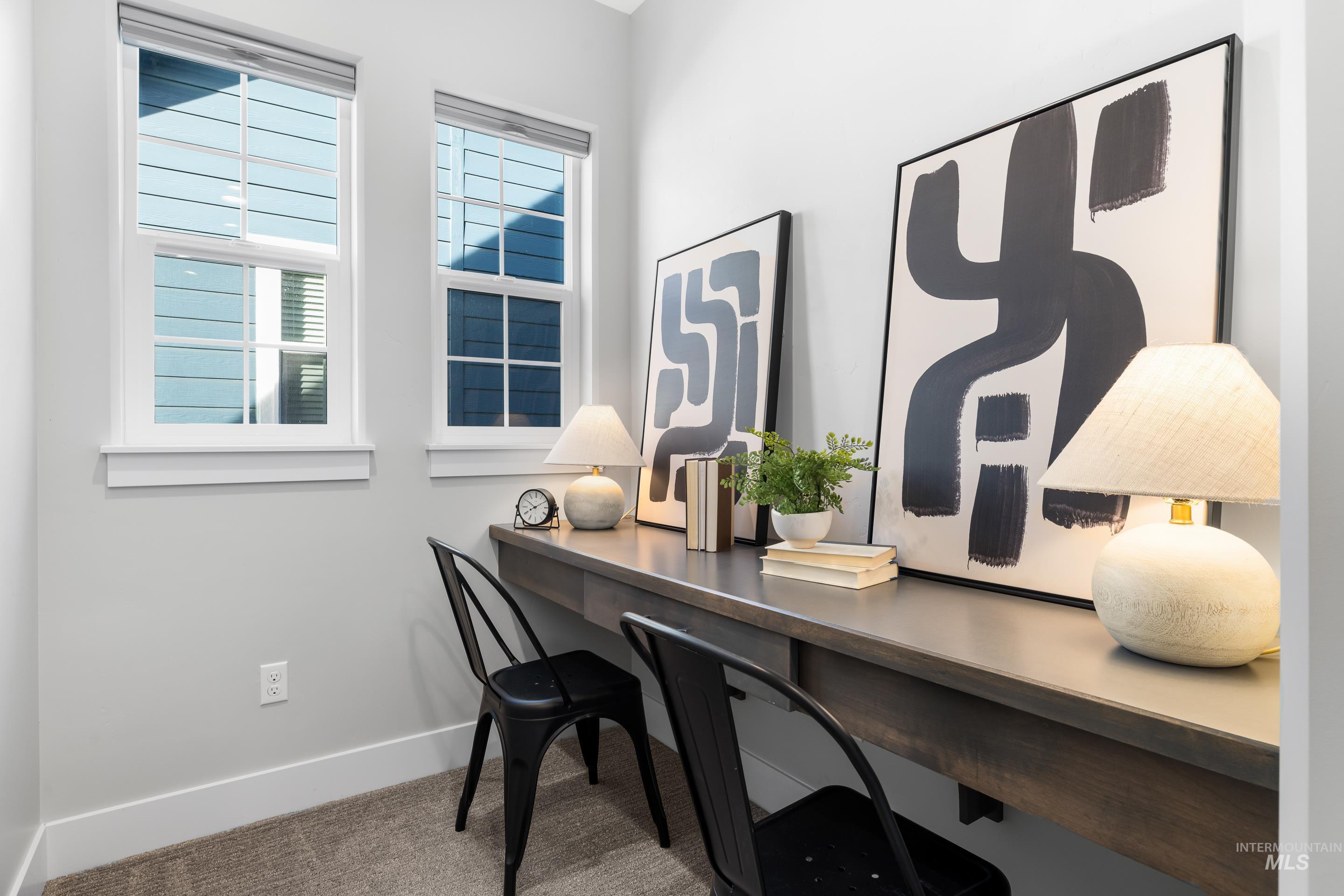 Home office featuring baseboards and carpet flooring