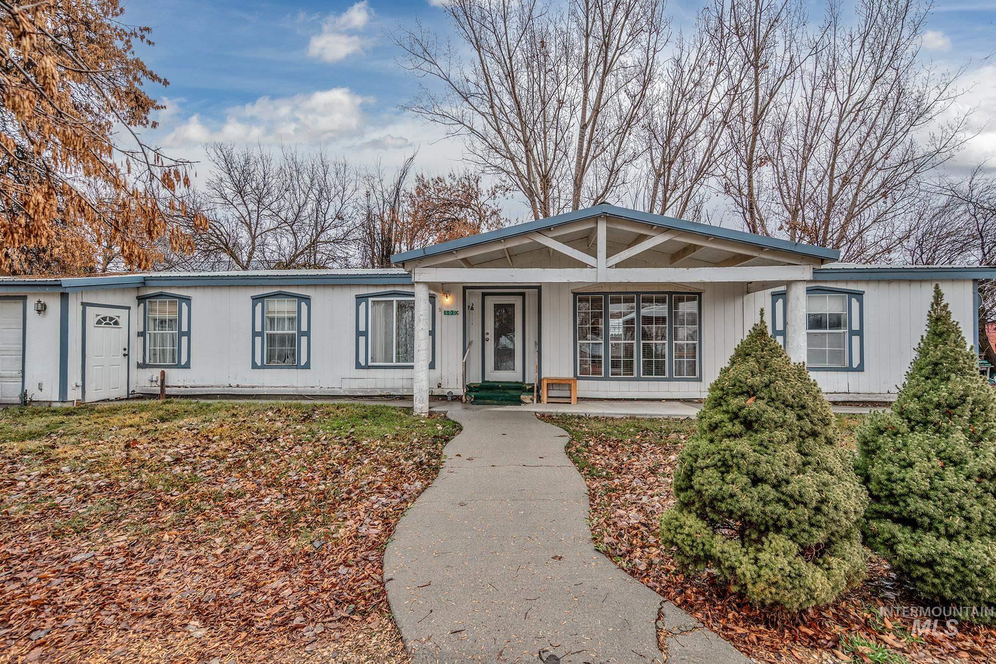 Single story home featuring a porch