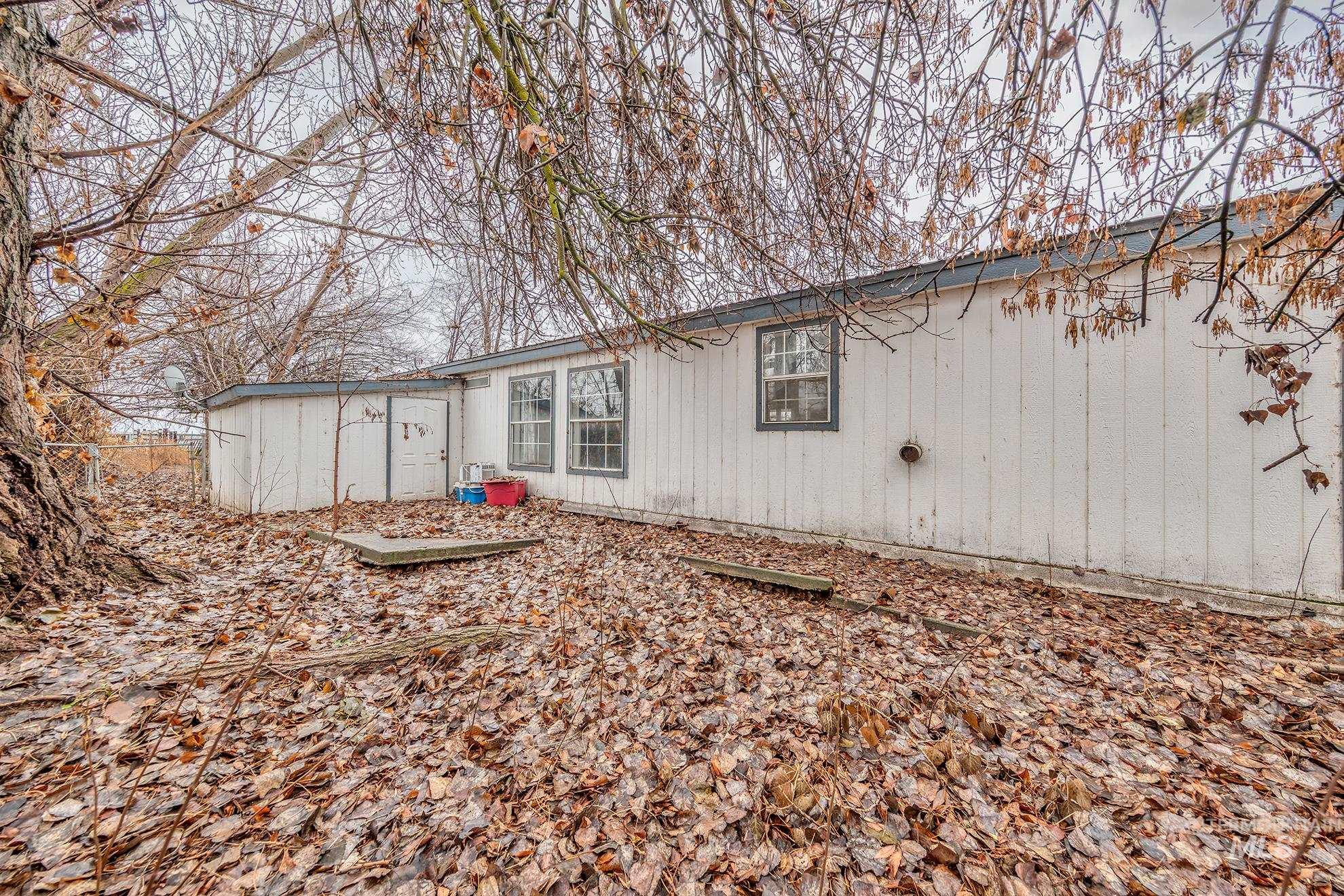 Back of property with an outbuilding