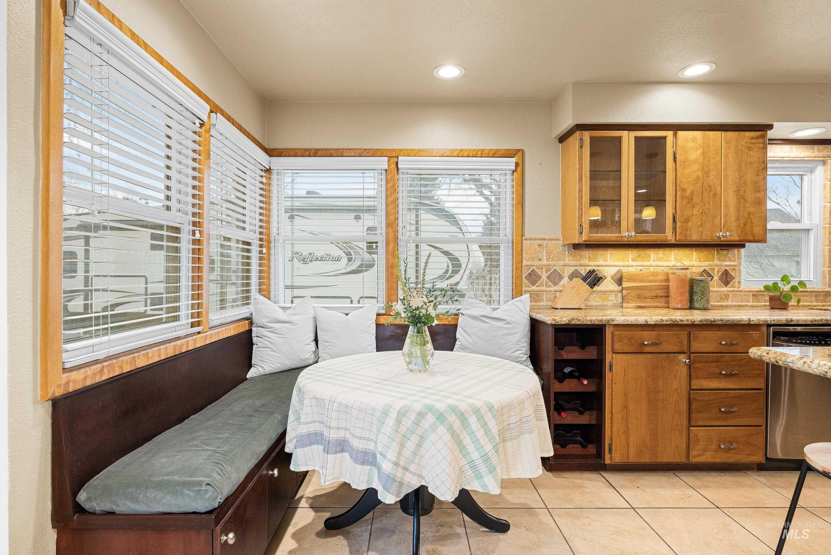 Dining room featuring light tile patterned flooring and recessed lighting