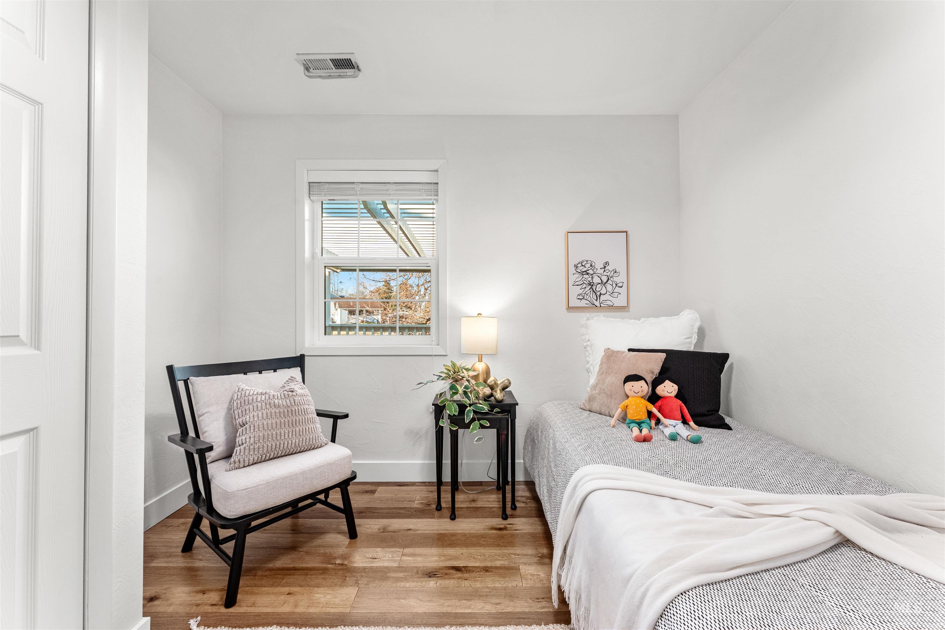 Bedroom featuring light wood-style flooring and baseboards