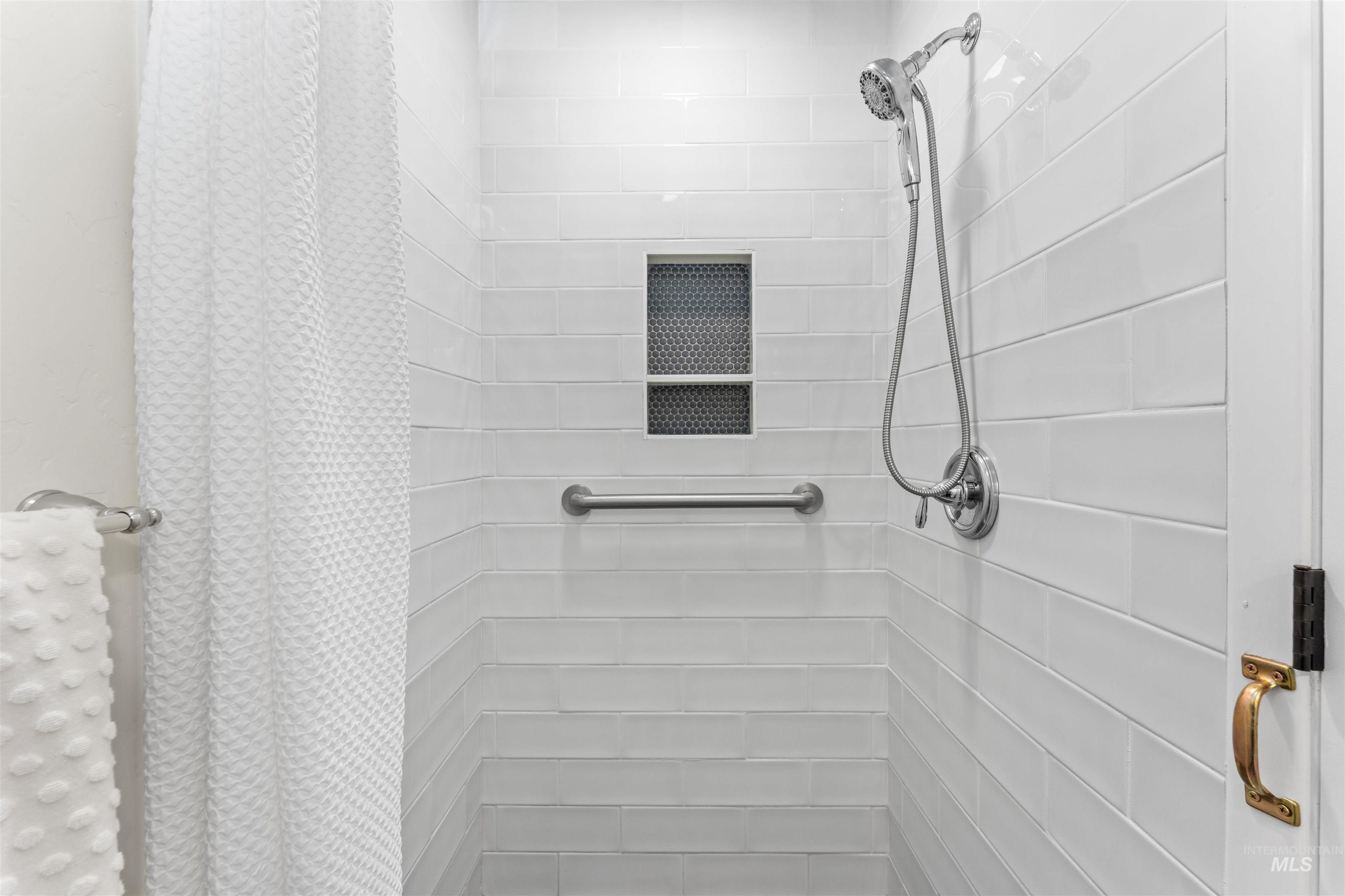Full bathroom featuring a stall shower
