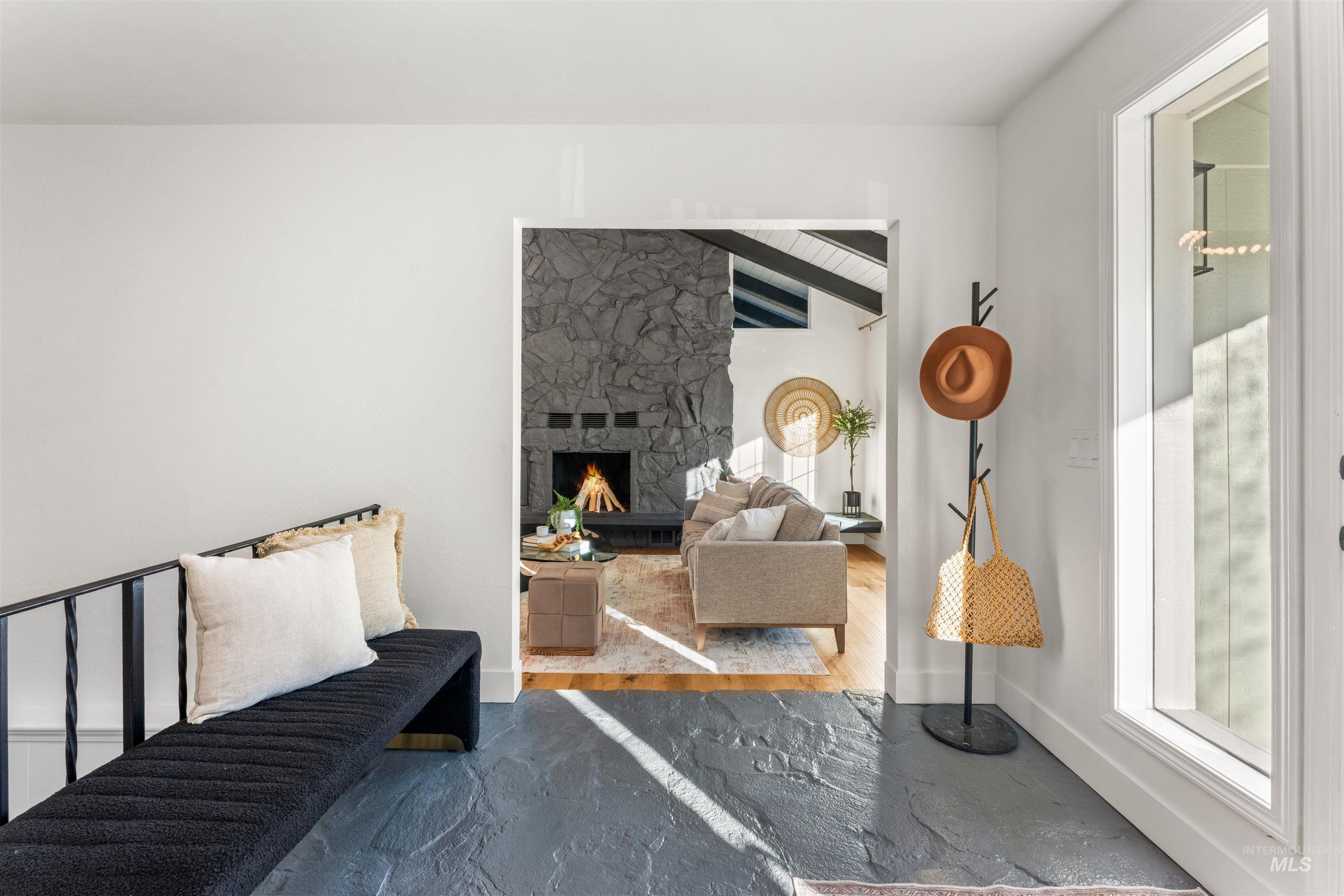 Bedroom with a stone fireplace