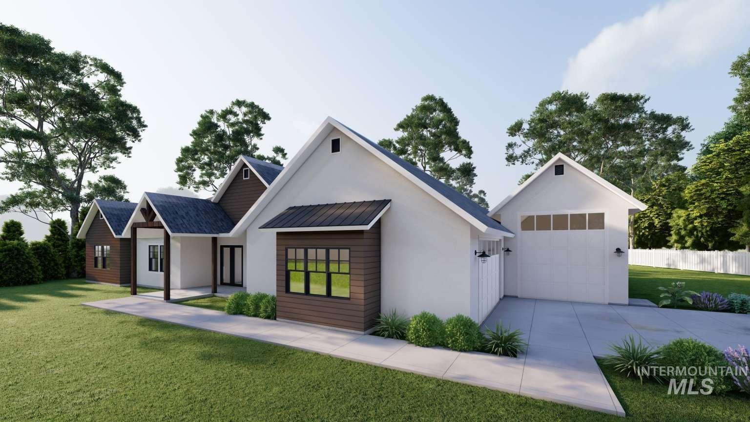 Modern farmhouse style home with driveway and stucco siding