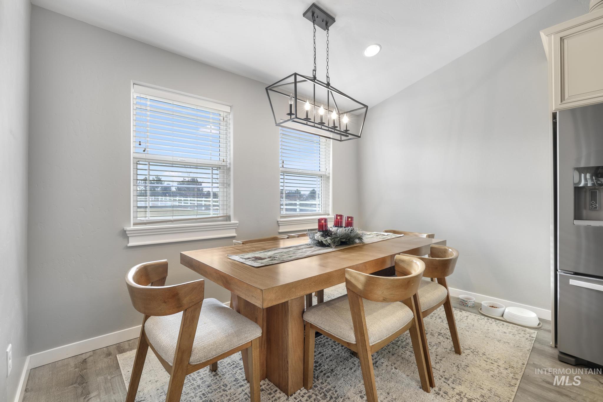 Dining area featuring recessed lighting and light wood-style flooring
