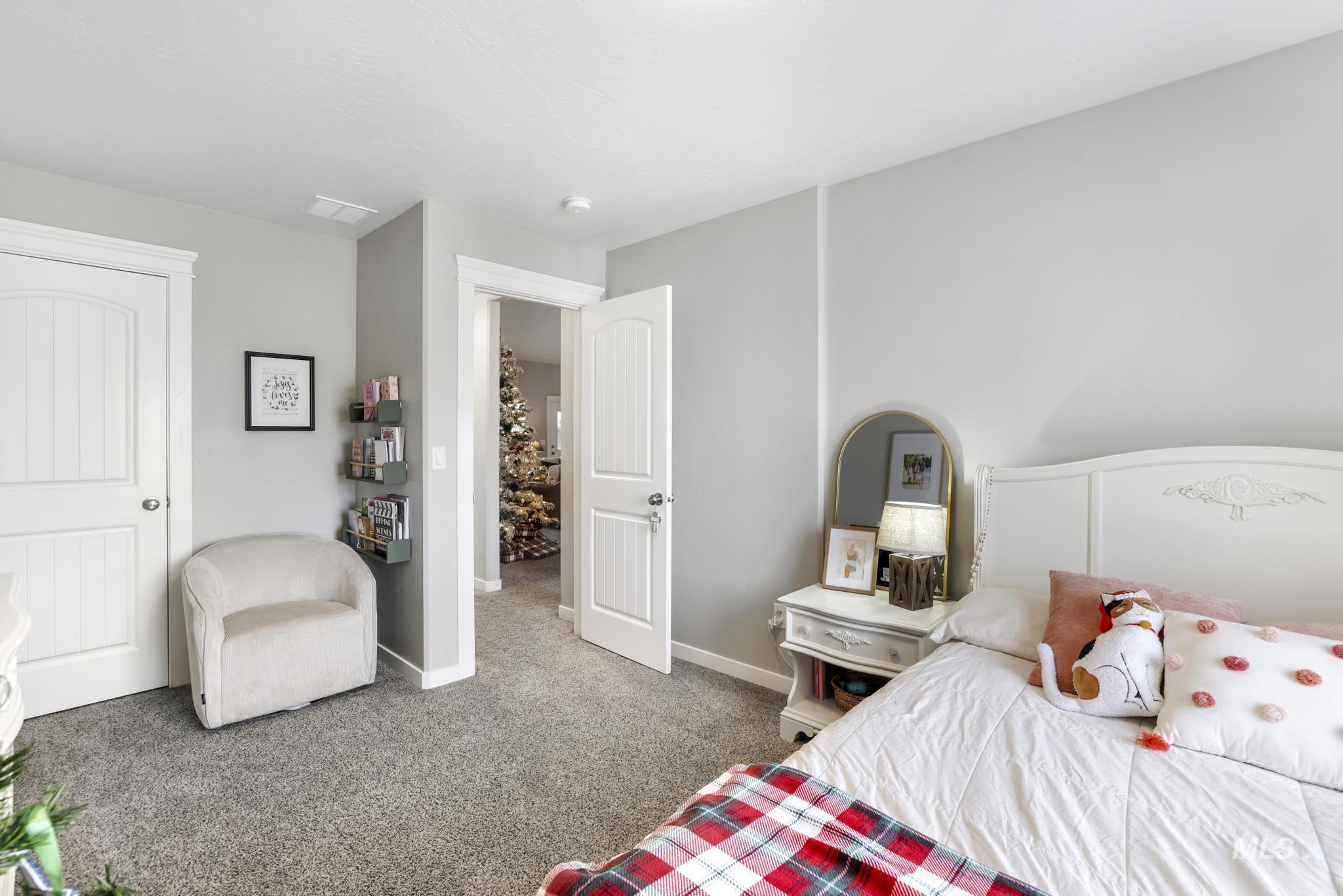 Bedroom with carpet floors and baseboards