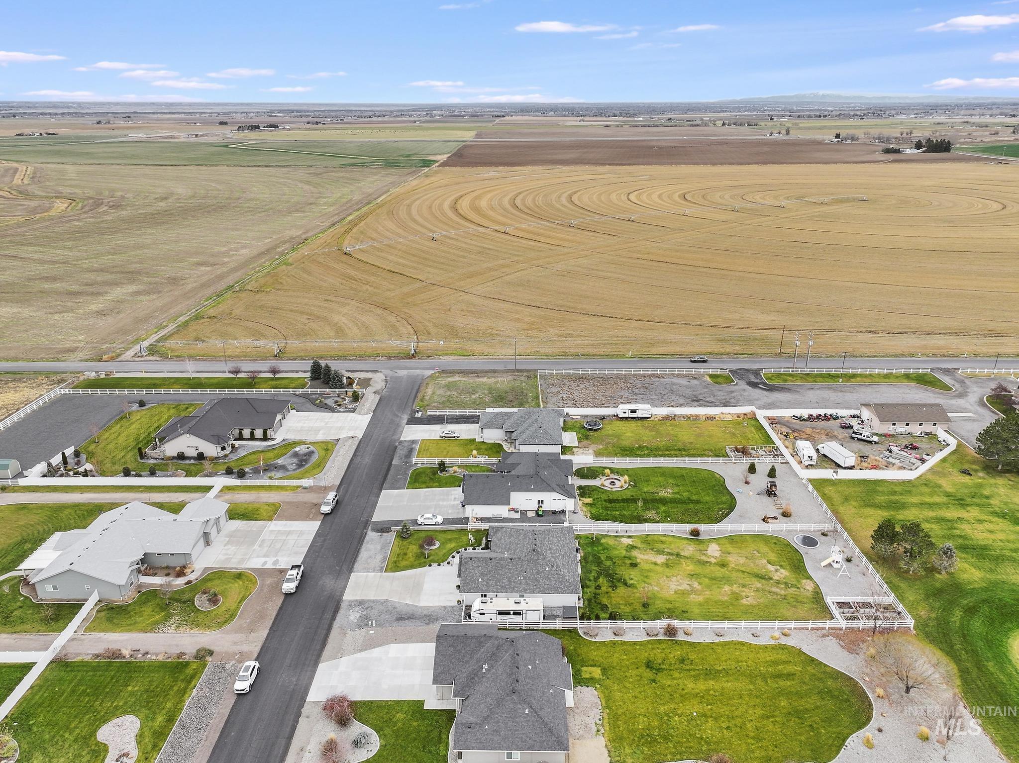 Aerial view of property's location with nearby suburban area
