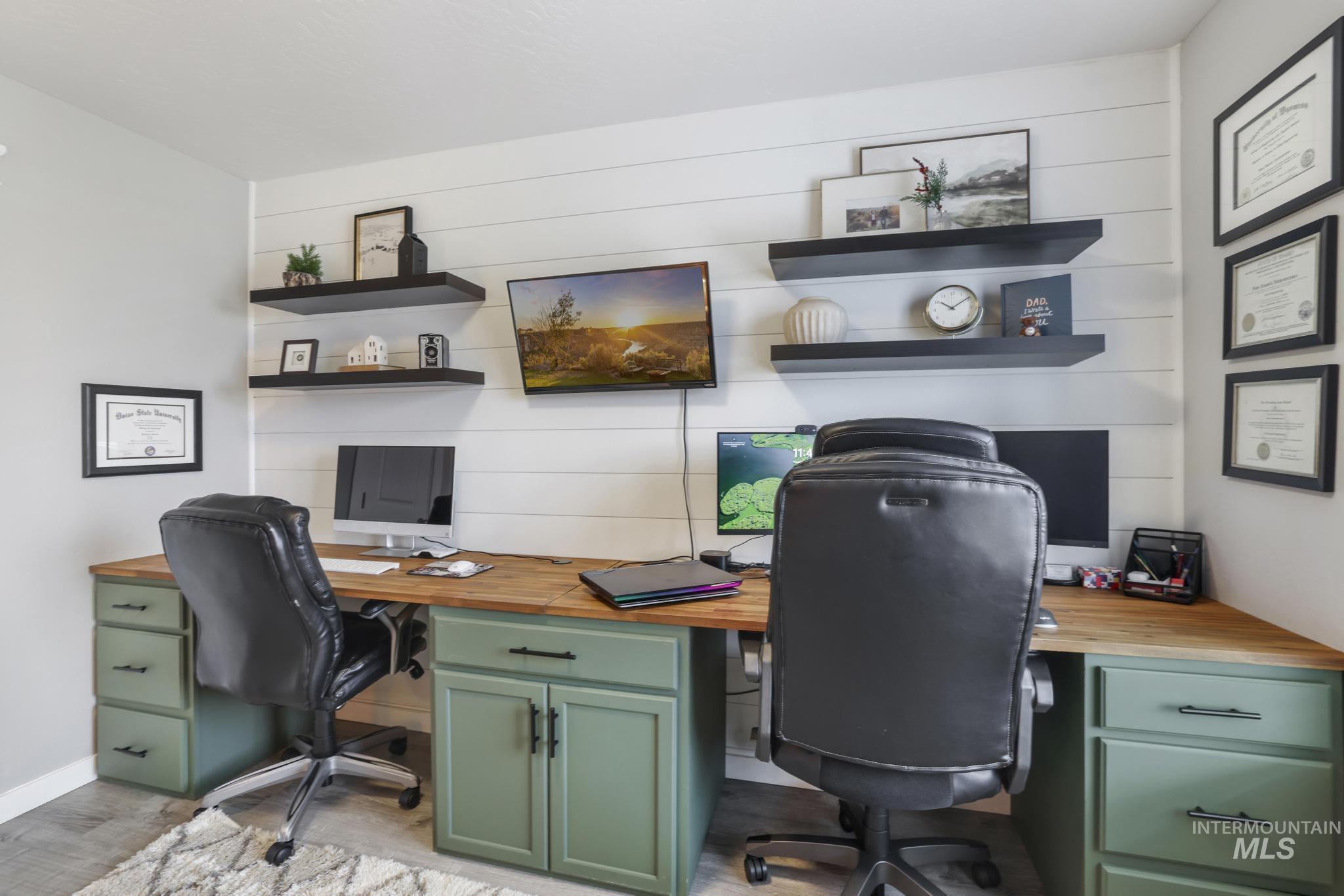 Office space featuring built in study area and baseboards