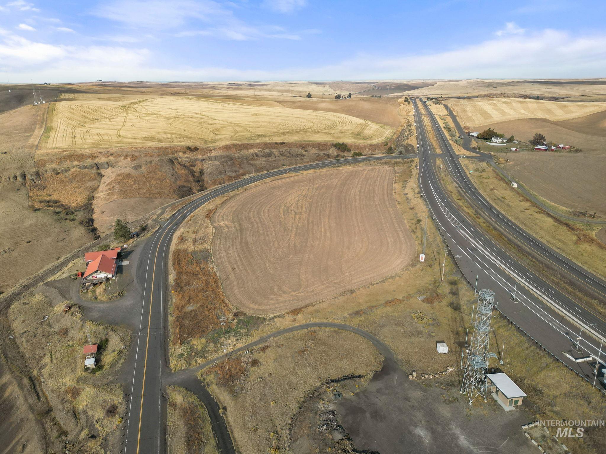 Aerial view of property and surrounding area with rural landscape