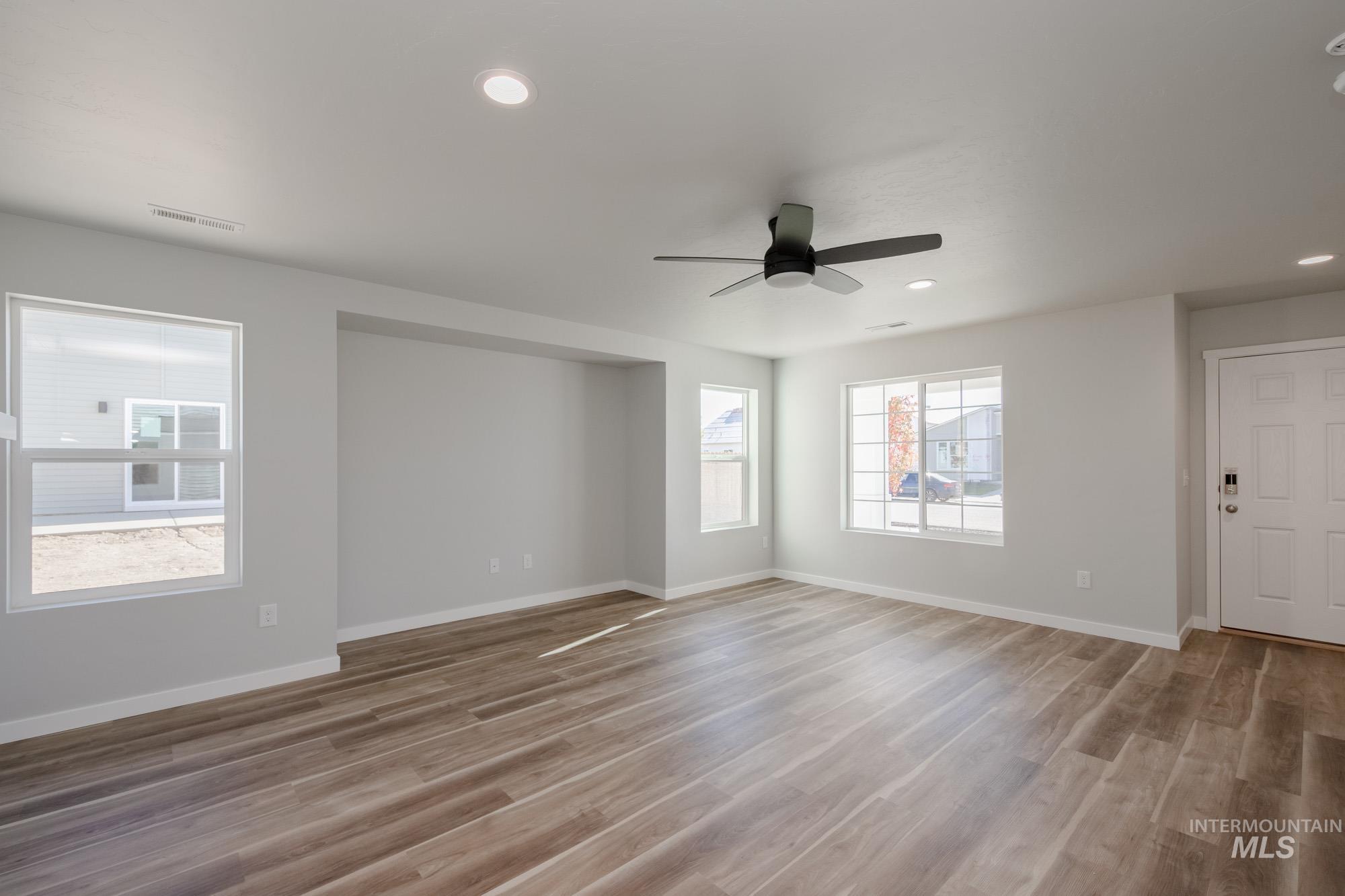 Unfurnished room featuring light wood-type flooring, recessed lighting, and a ceiling fan
