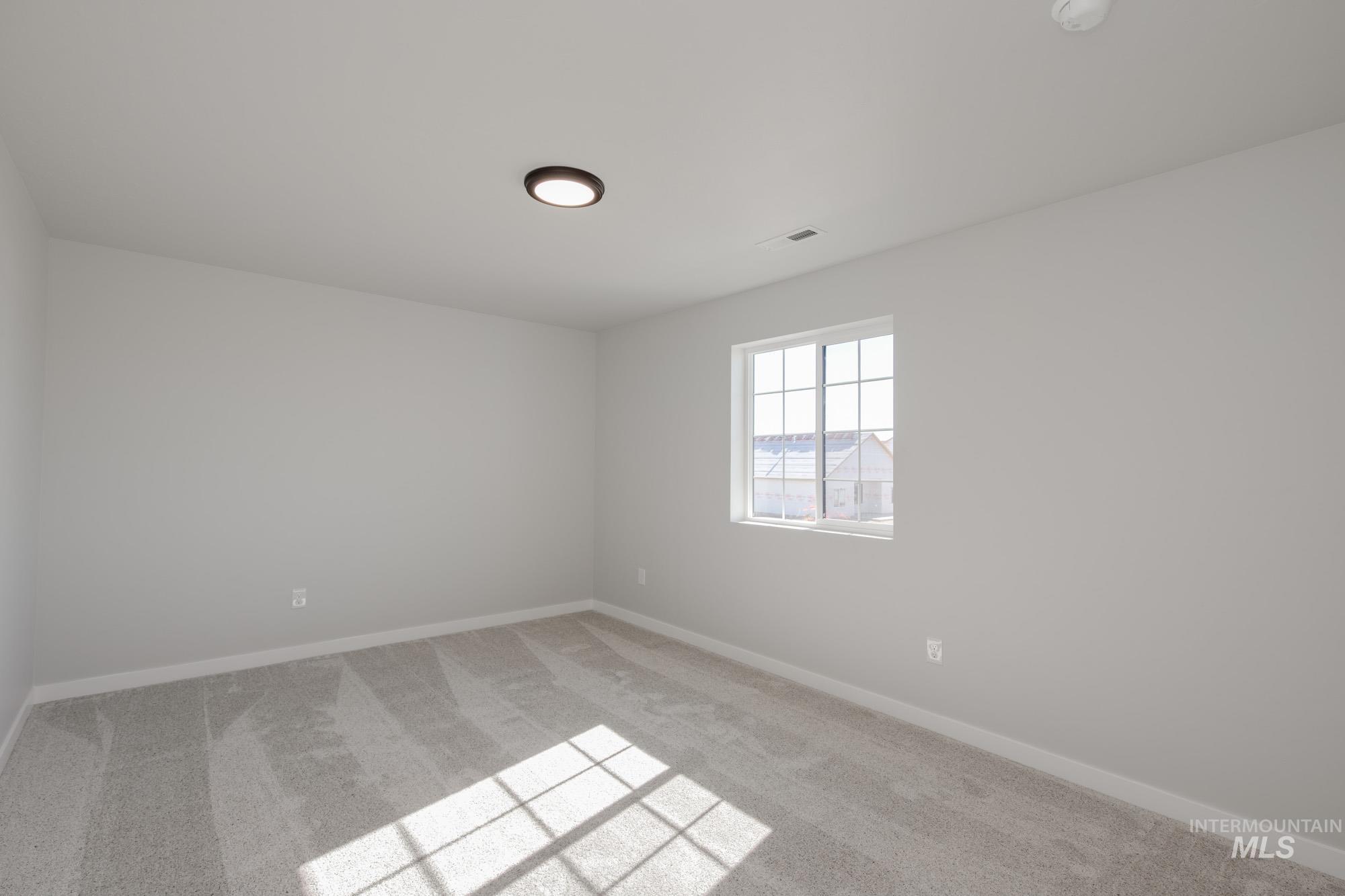 Unfurnished room featuring carpet flooring and baseboards
