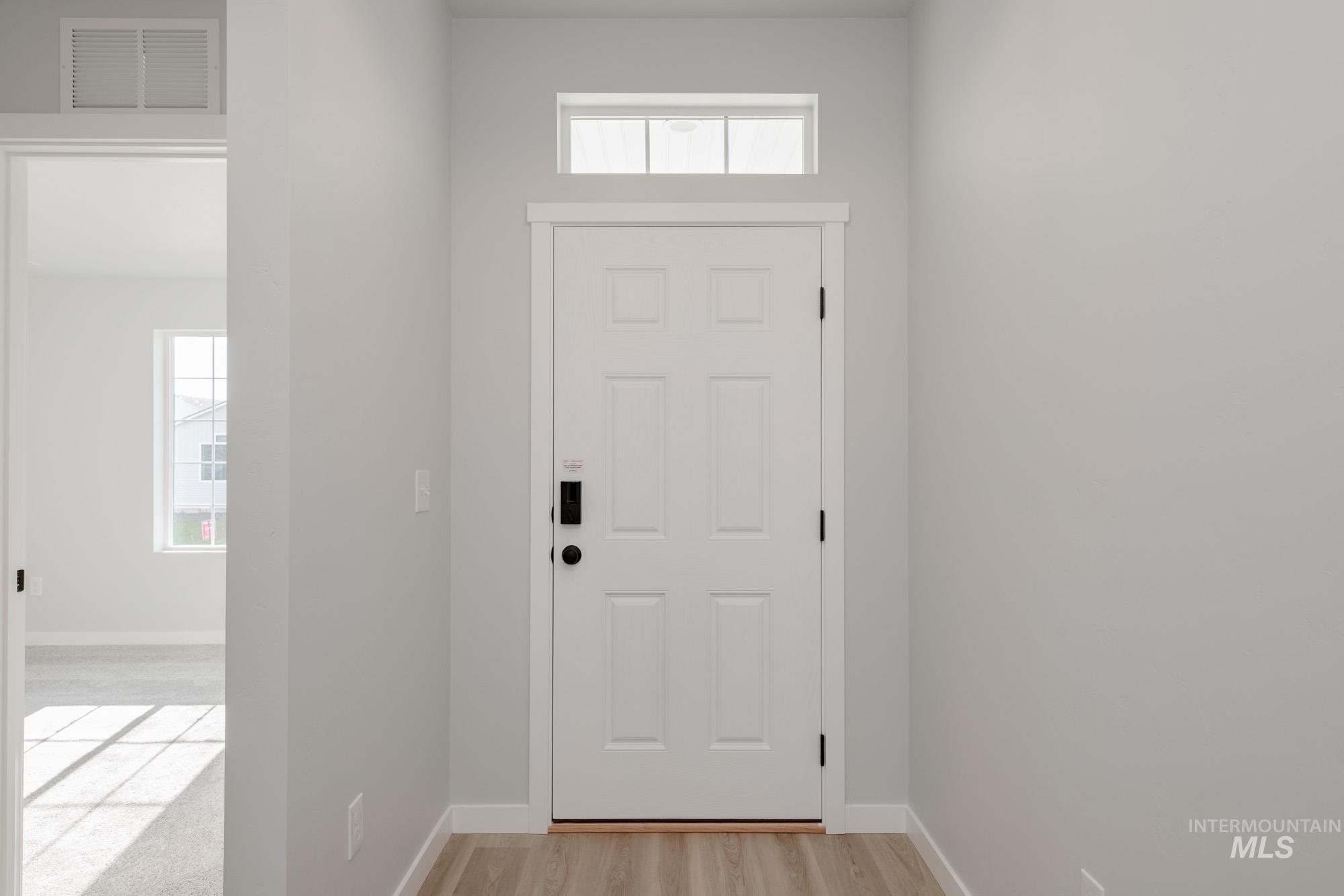 Doorway to outside featuring healthy amount of natural light