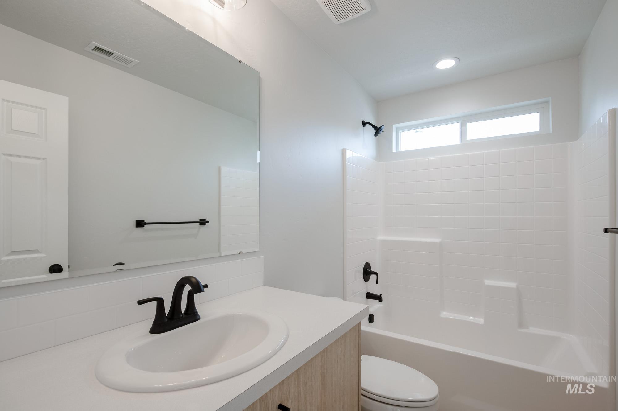 Full bathroom with bathtub / shower combination and vanity
