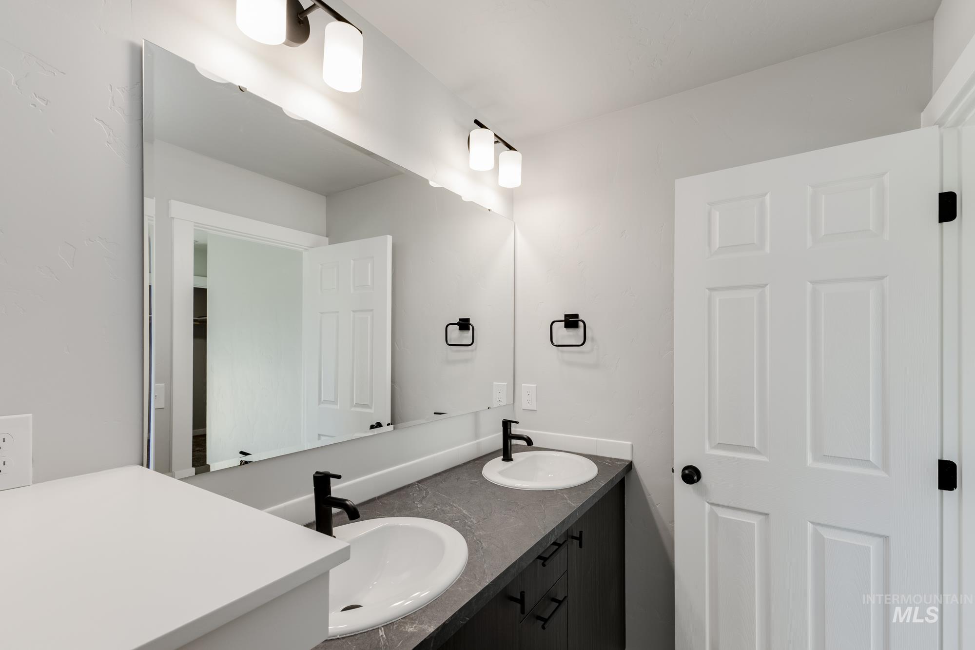 Bathroom featuring double vanity