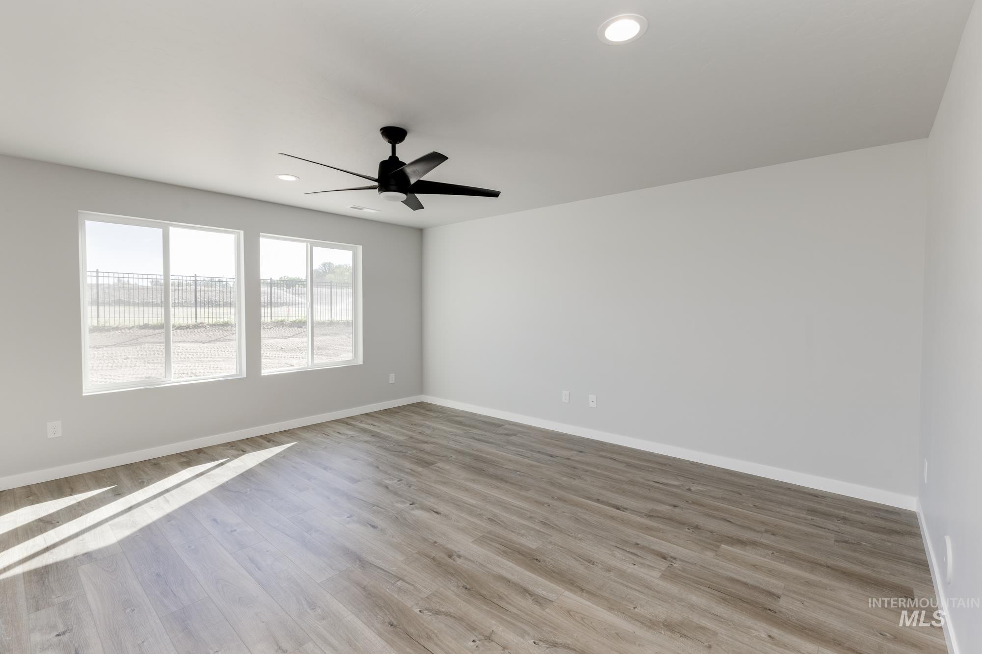 Unfurnished room featuring light wood-style floors, recessed lighting, and ceiling fan
