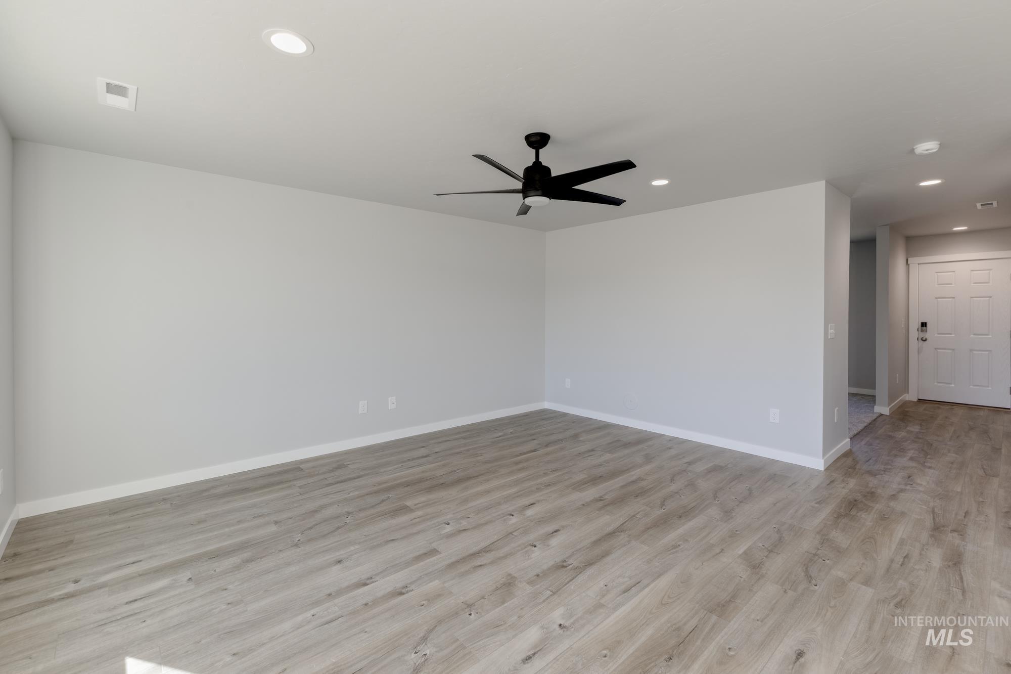 Unfurnished room with light wood finished floors, recessed lighting, and ceiling fan